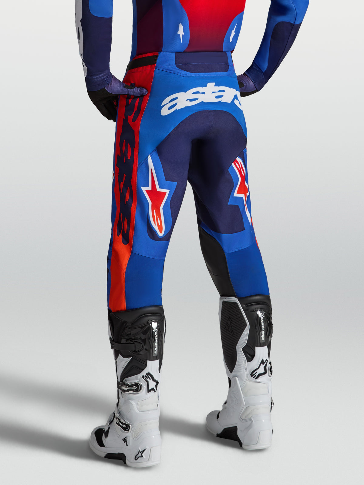 Alpinestars Racer Hunt Pants, blue and red motocross pants with a pre-curved race fit for professional off-road performance.