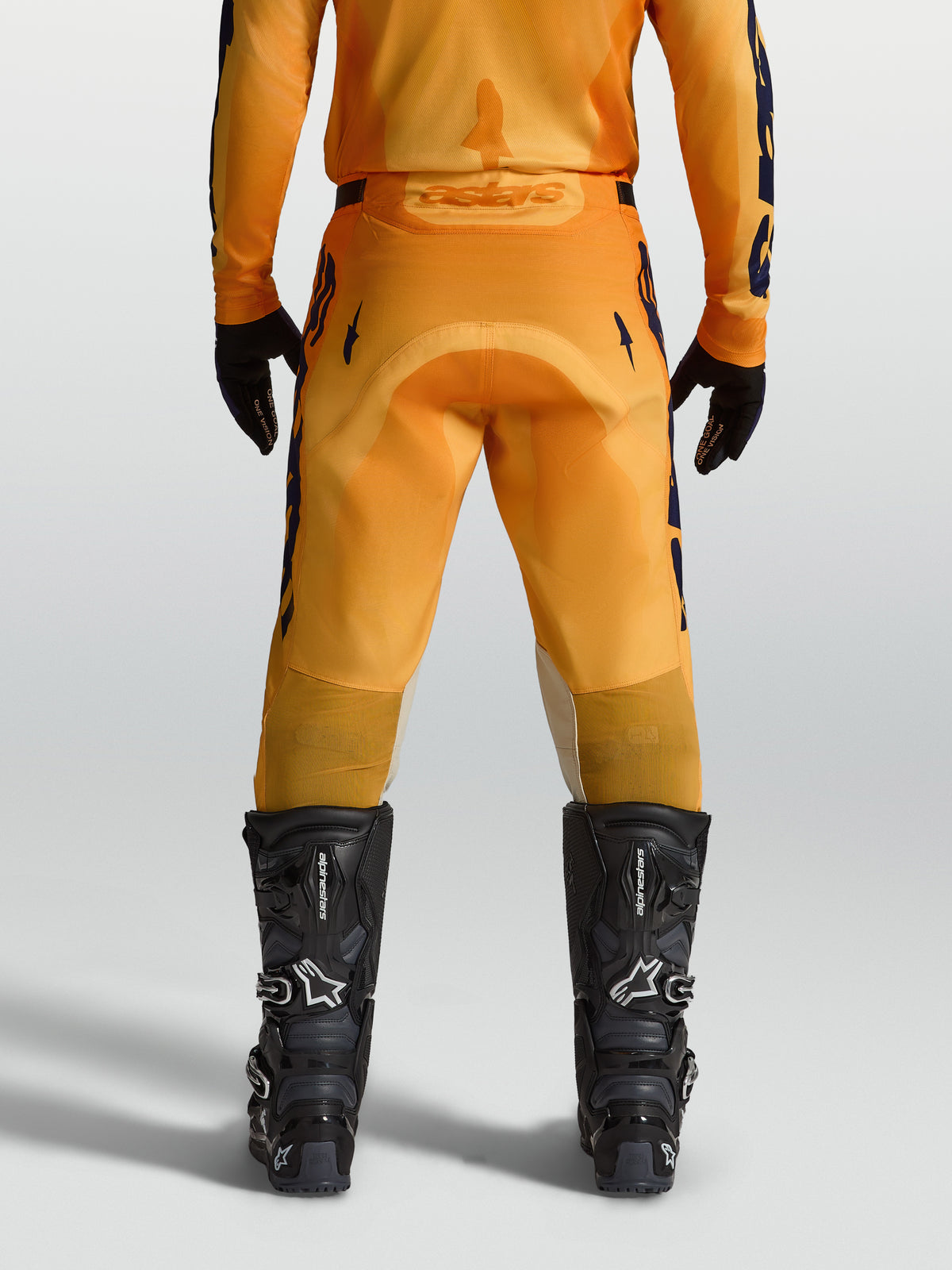 Alpinestars Racer Amber Pants, Men's Motocross Pants in Orange and Deep Blue, featuring a durable reinforced seat.