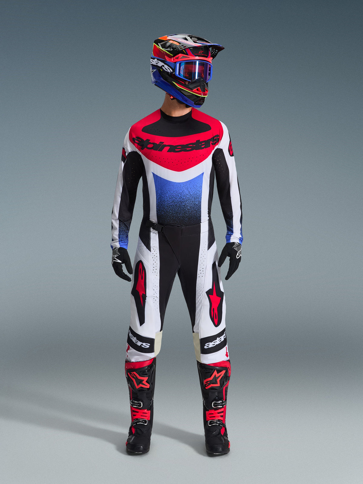 2026 Techstar Knif Gear Set, Motocross Outfit, Red White and Blue Jersey with Alpinestars logo, matching White and Black Pants with Red details, Colorful Racing Helmet with Blue Goggles, Black Boots with Red accents, complete MX racing kit
