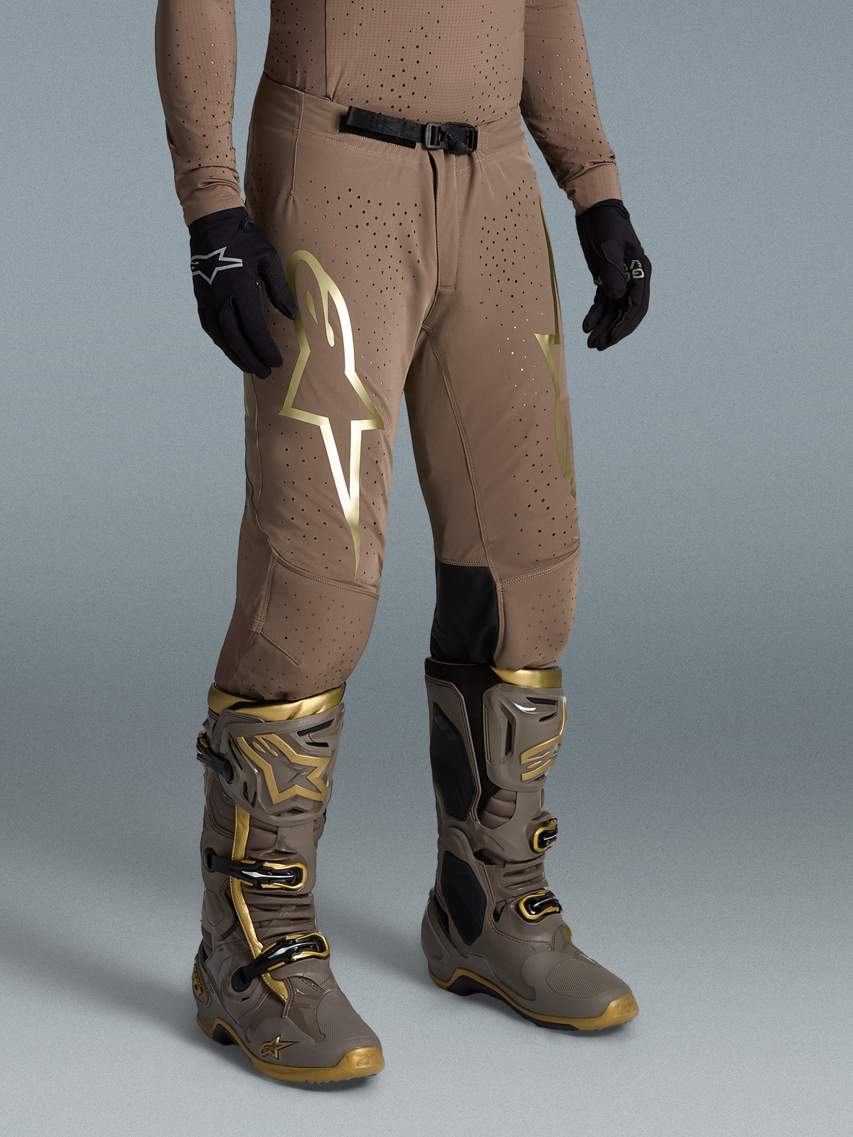Alpinestars Limited Edition Supertech Air Gold Pants for motocross, Earth Brown with gold logo and perforated stretch fabric.