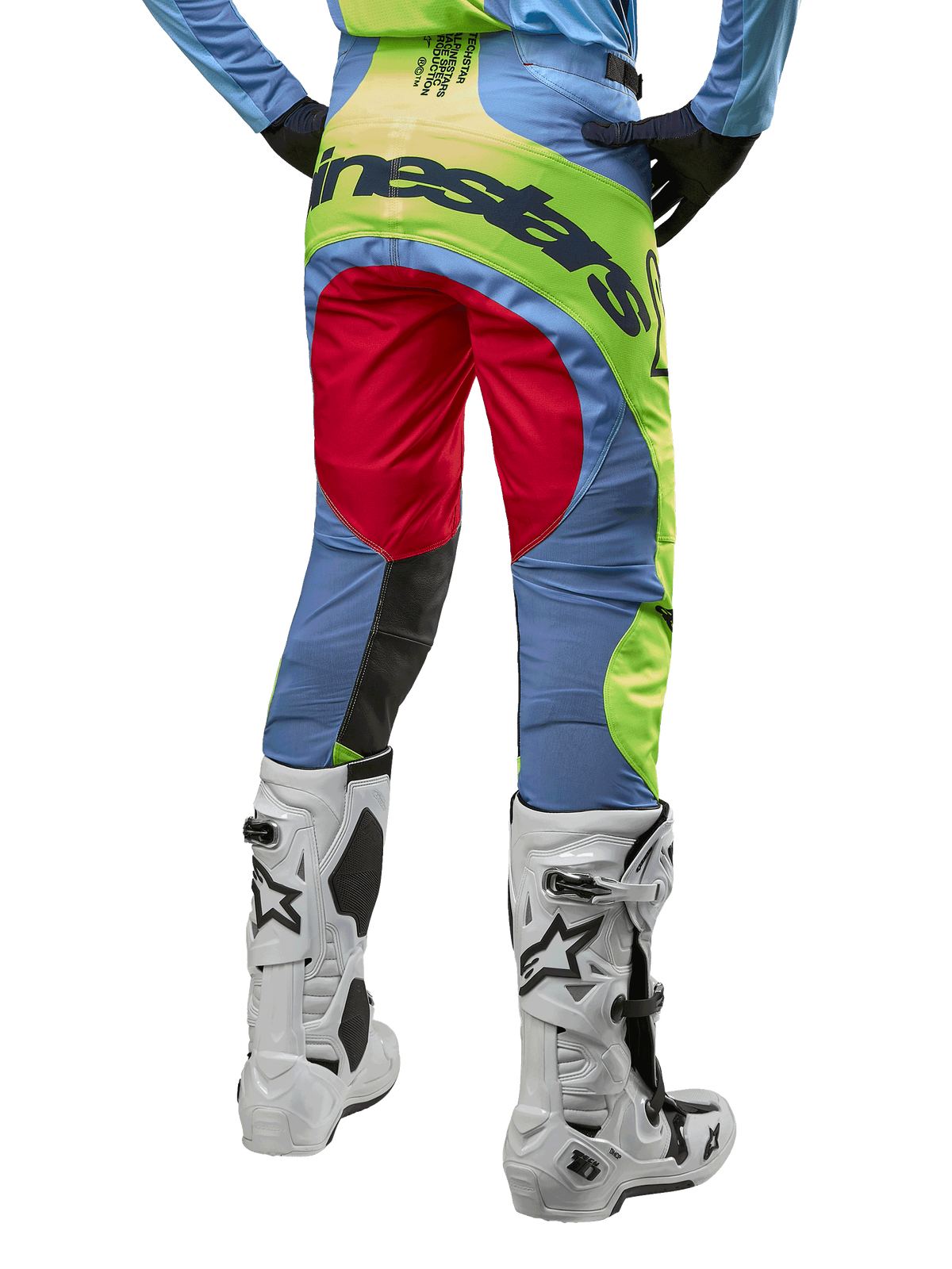 Alpinestars 2024 Techstar Ocuri Pants, Motocross Pants, Light Blue Yellow Fluo and Red Berry, back view worn with white and black motocross boots, featuring vibrant color-blocking and bold Alpinestars branding on the seat.