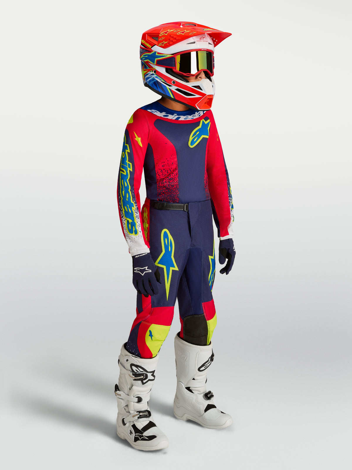 Pantalones Alpinestars Fluid Drag Juvenil, equipo de motocross azul marino y rojo, diseño para carreras todoterreno.