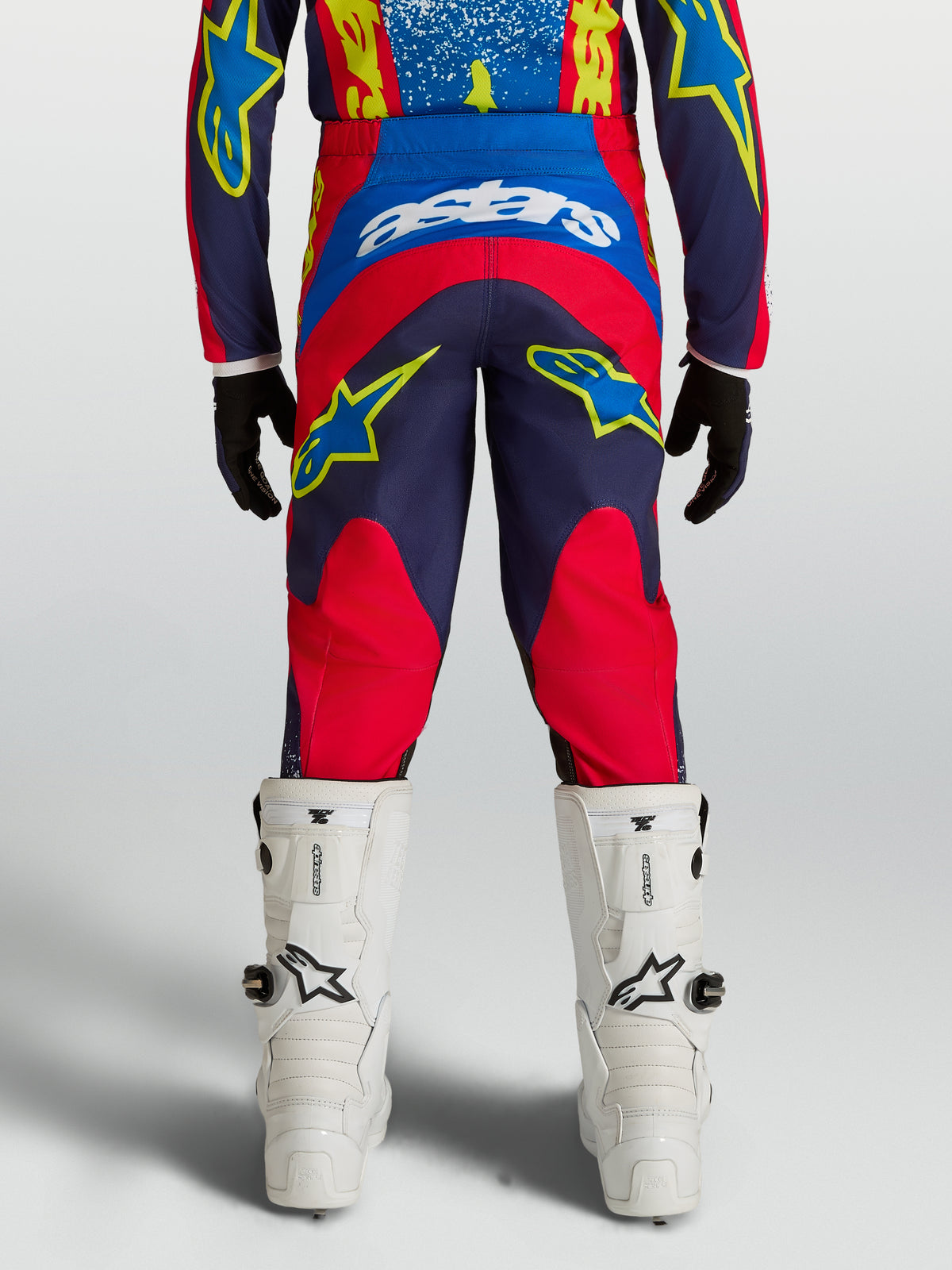 Alpinestars Youth Fluid Drag Pants, Motocross Racing, Blue Navy and Fire Red, durable 600D textile with ergonomic rear fit.