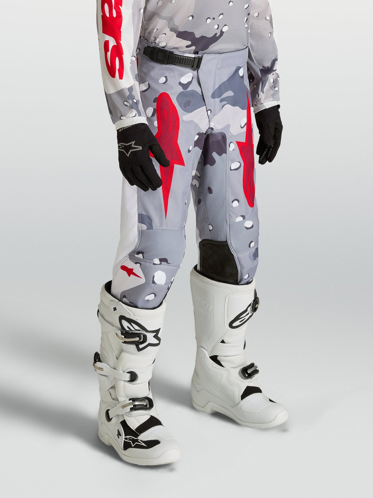 Alpinestars Youth Fluid Lone Pants in Gray Camo and Fire Red, durable off-road motocross gear with 600D polyfabric.