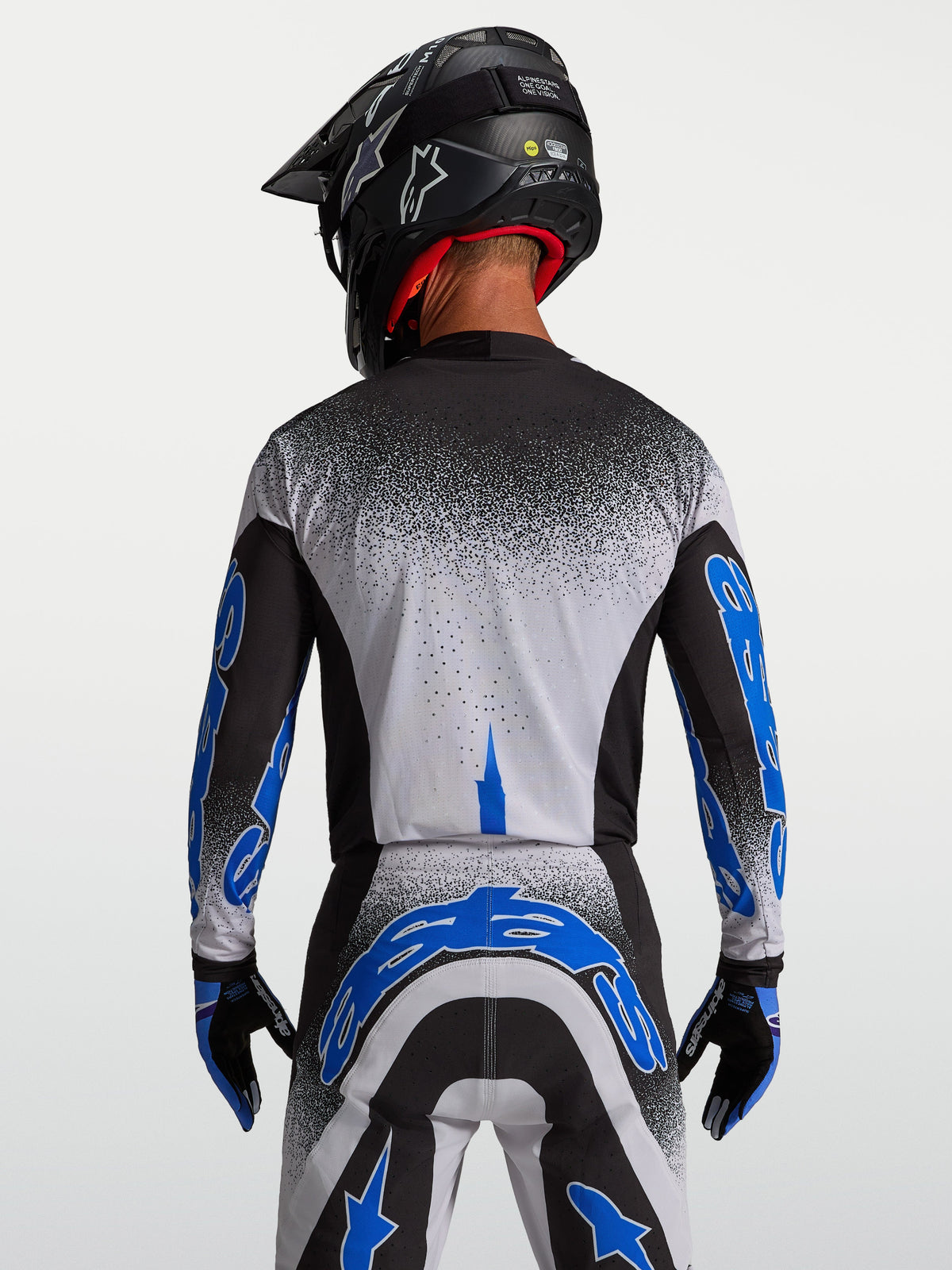 Alpinestars Jersey Supertech Hiten AFD, jersey de motocross para hombre, negro y azul, vista posterior con ajuste atlético.