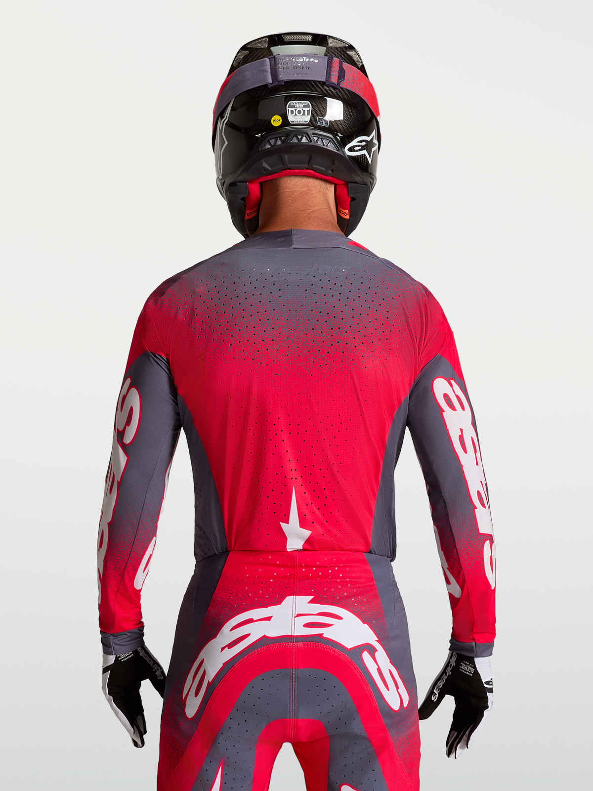 Jersey Alpinestars Supertech Hiten AFD, para carreras de motocross, gris y rojo fluo, vista posterior, tejido de malla transpirable con perforaciones láser