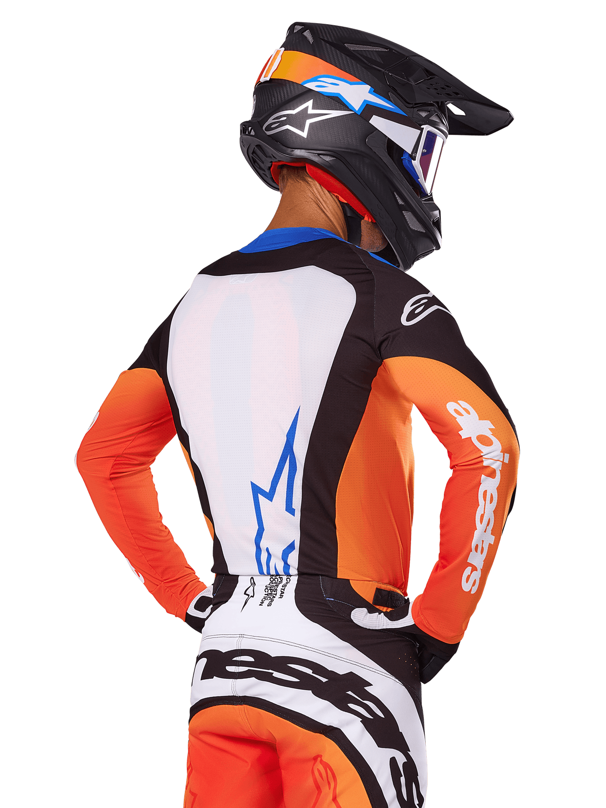 Motocross rider wearing Alpinestars 2025 Techstar Melt Jersey, Orange and Blue, rear view showing white back panel with blue logo, orange sleeves with white branding, matching motocross helmet and pants, professional racing gear.