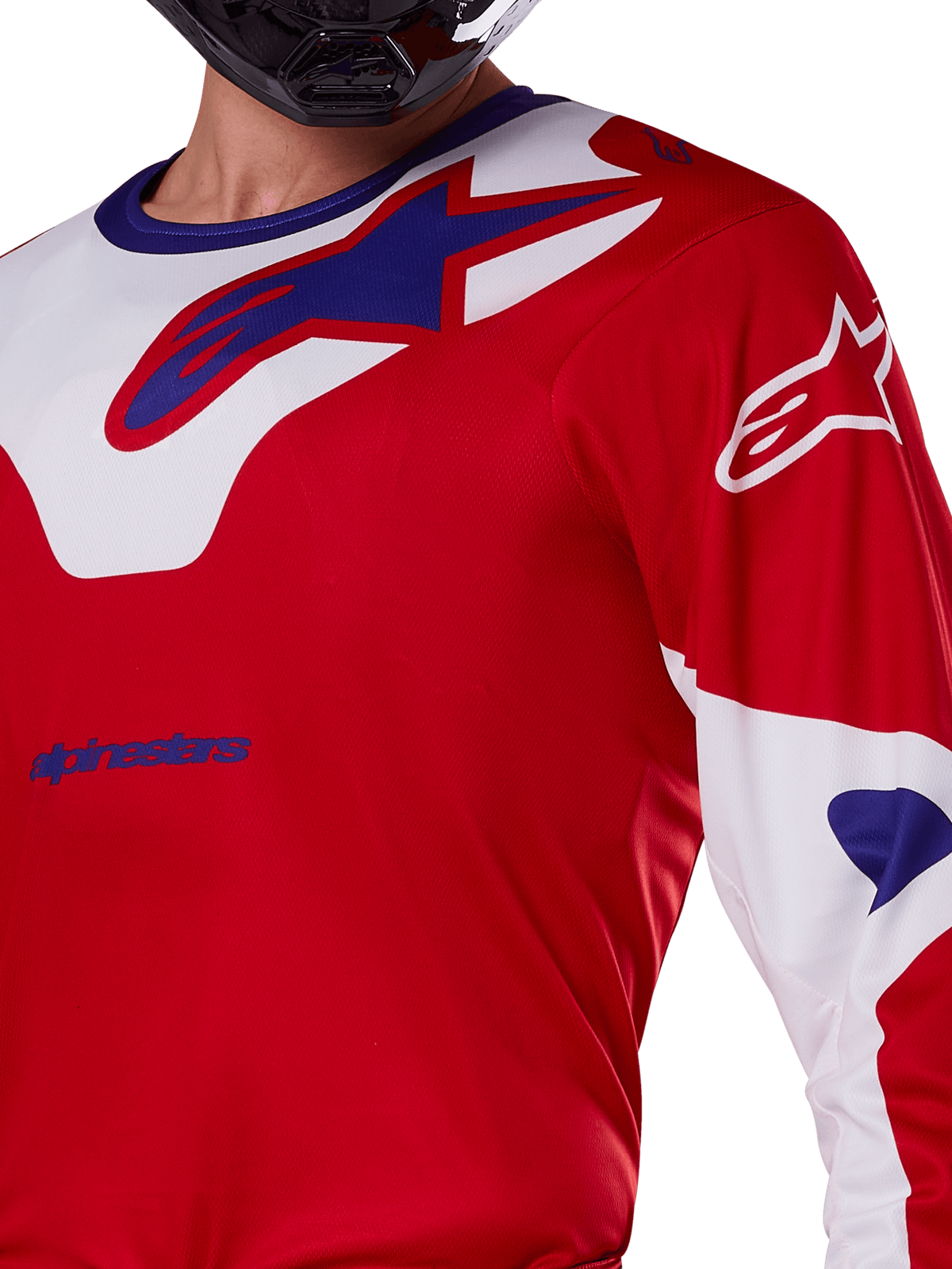 Alpinestars 2025 Racer Veil Jersey, Motocross Jersey, Bright Red and White, close-up view of the upper torso and chest, blue Alpinestars logo on a white collar panel, red sleeves with white accents, worn with a black helmet, technical off-road riding apparel