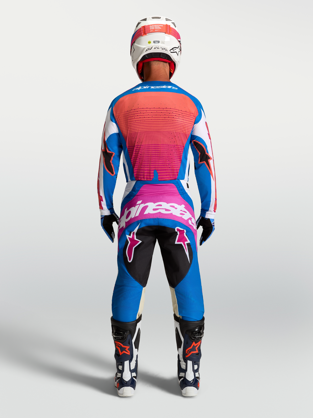 Alpinestars Techstar Maven Jersey y Techstar Maven Gear Set, azul y coral vivo, equipación de motocross, vista posterior.