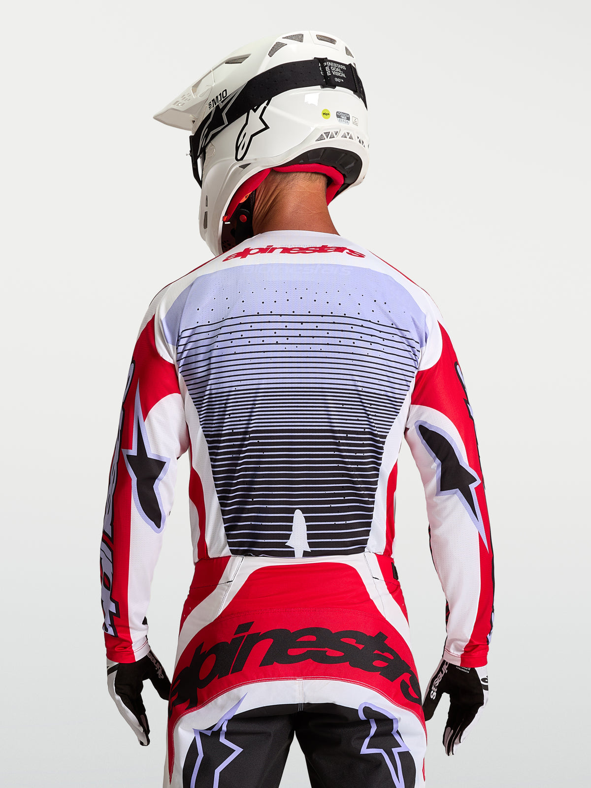 Alpinestars Techstar Maven Jersey, Motocross Racing Jersey, Fire Red and White, breathable textile, back view on rider.