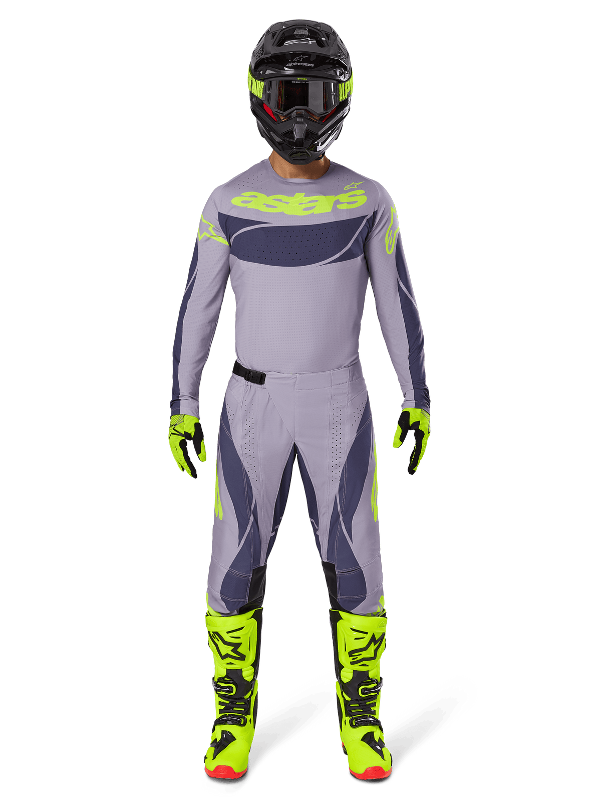 Piloto de motocross con equipamiento completo, Jersey Techstar Dreem 2025 en gris y gris oscuro con logotipos en amarillo neón, pantalones a juego en gris y gris oscuro, botas amarillo neón y negras, casco negro con detalles neón, conjunto coordinado para motocross profesional