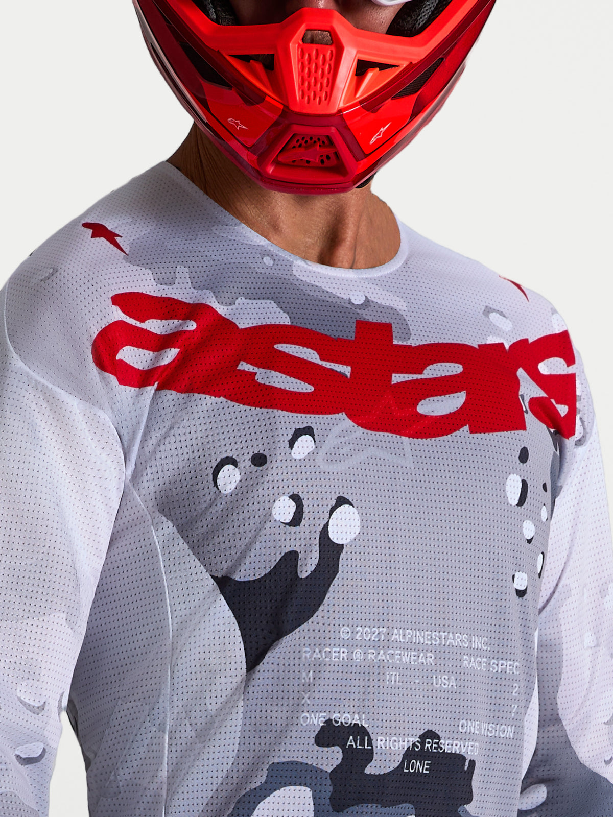 Alpinestars Racer Air Lone, jersey de motocross para hombre, gris camuflaje y rojo fuego, construcción de malla ventilada.