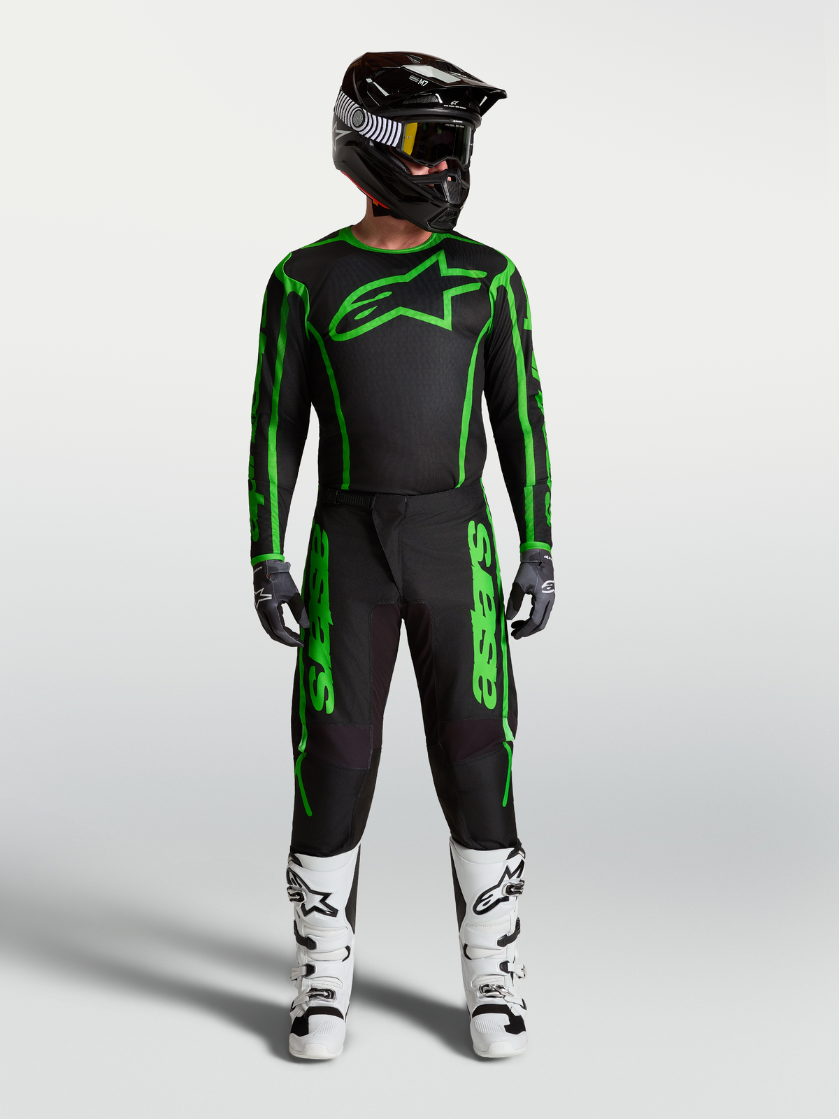 Alpinestars Fluid Apex V2 Pants, Men's Motocross Gear, Black and Green Fluo, full racing outfit with white boots.