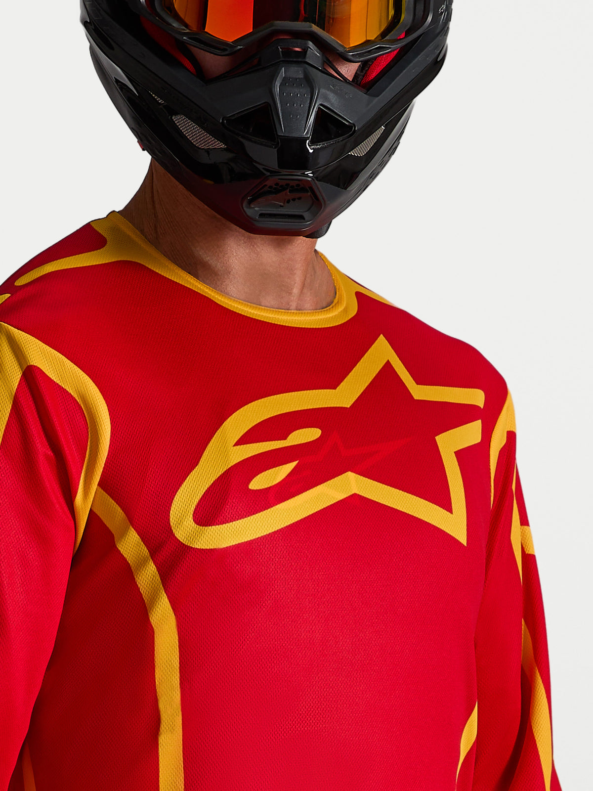 Alpinestars Fluid Apex V2 Jersey in Red and Gold, a moisture-wicking men's motocross jersey with a large chest star logo.