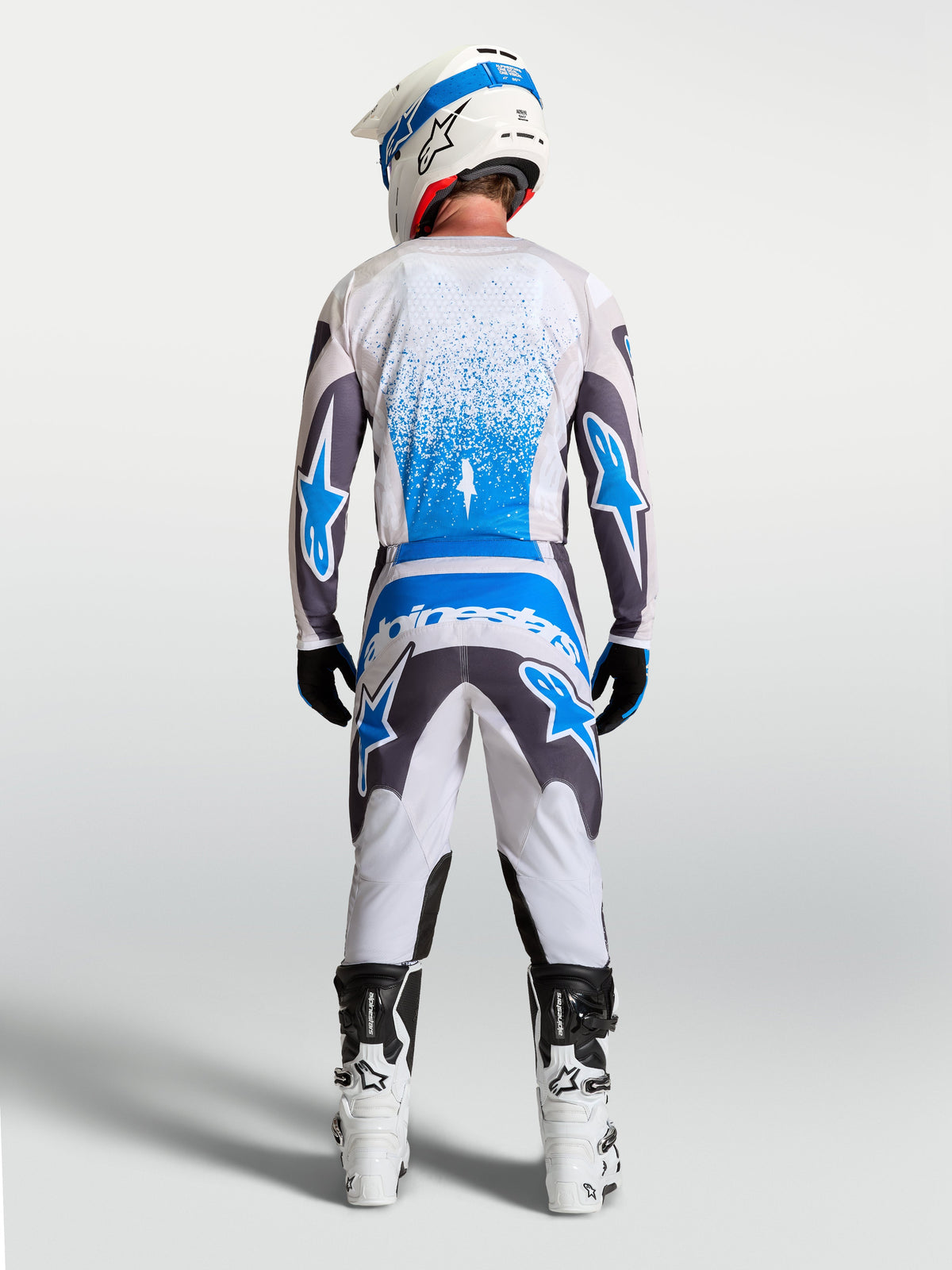 Alpinestars Fluid Drag Gear Set, conjunto de motocross para hombre, blanco, gris y azul, vista trasera, jersey y pantalones