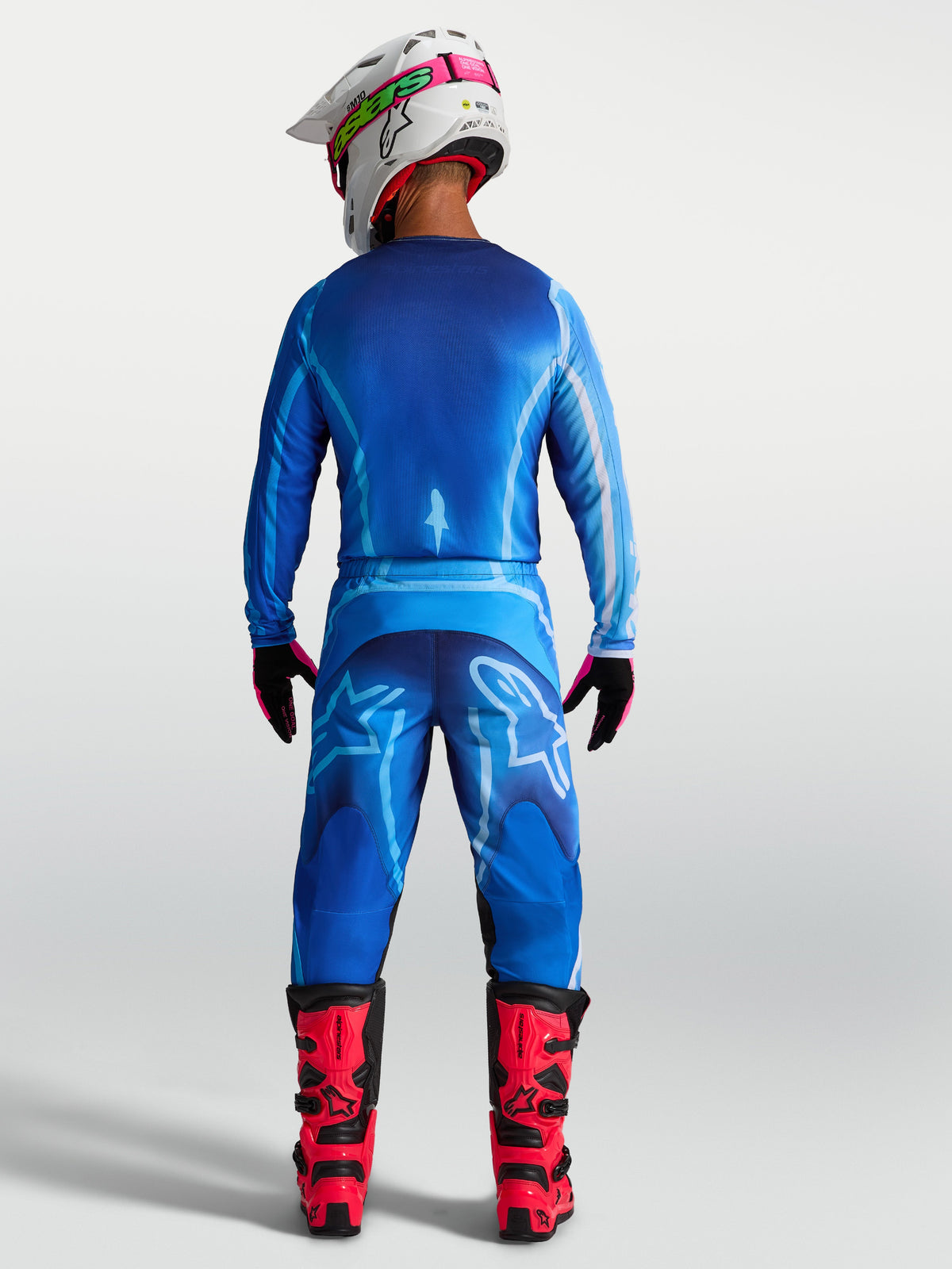 Jersey Alpinestars Fluid Kepler, vista trasera, jersey de motocross para hombre, azul, tejido ligero con dobladillo largo.