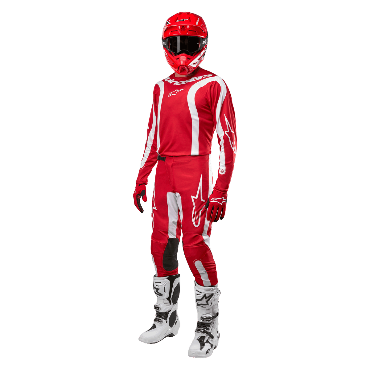 Piloto de motocross con equipamiento completo, Jersey Alpinestars Fluid Lurv 2024 en rojo Mars y blanco, pantalones rojos a juego con detalles blancos, casco rojo, guantes rojos y botas blancas y negras, conjunto coordinado para carreras todoterreno