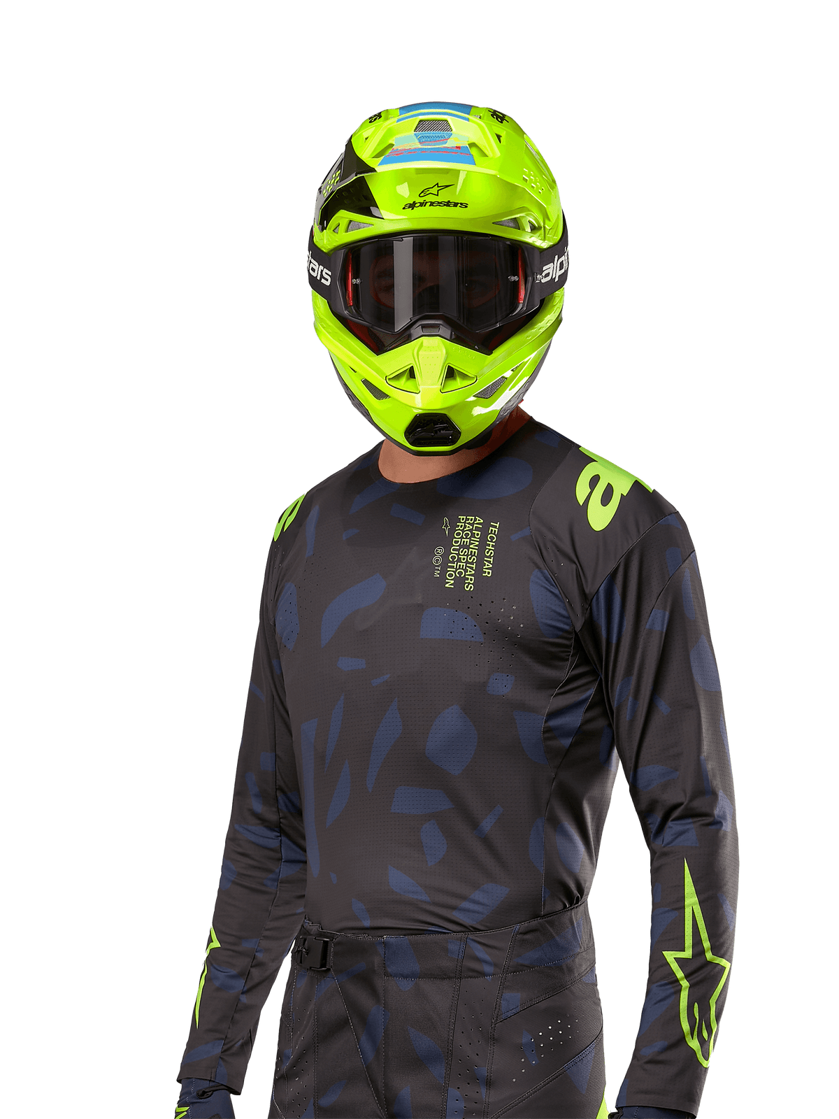 Alpinestars 2024 Techstar Rantera Jersey, jersey de motocross, negro y azul marino con patrones abstractos y detalles en amarillo neón, usado con casco amarillo neón a juego, diseño de ajuste de alto rendimiento para conducción todoterreno