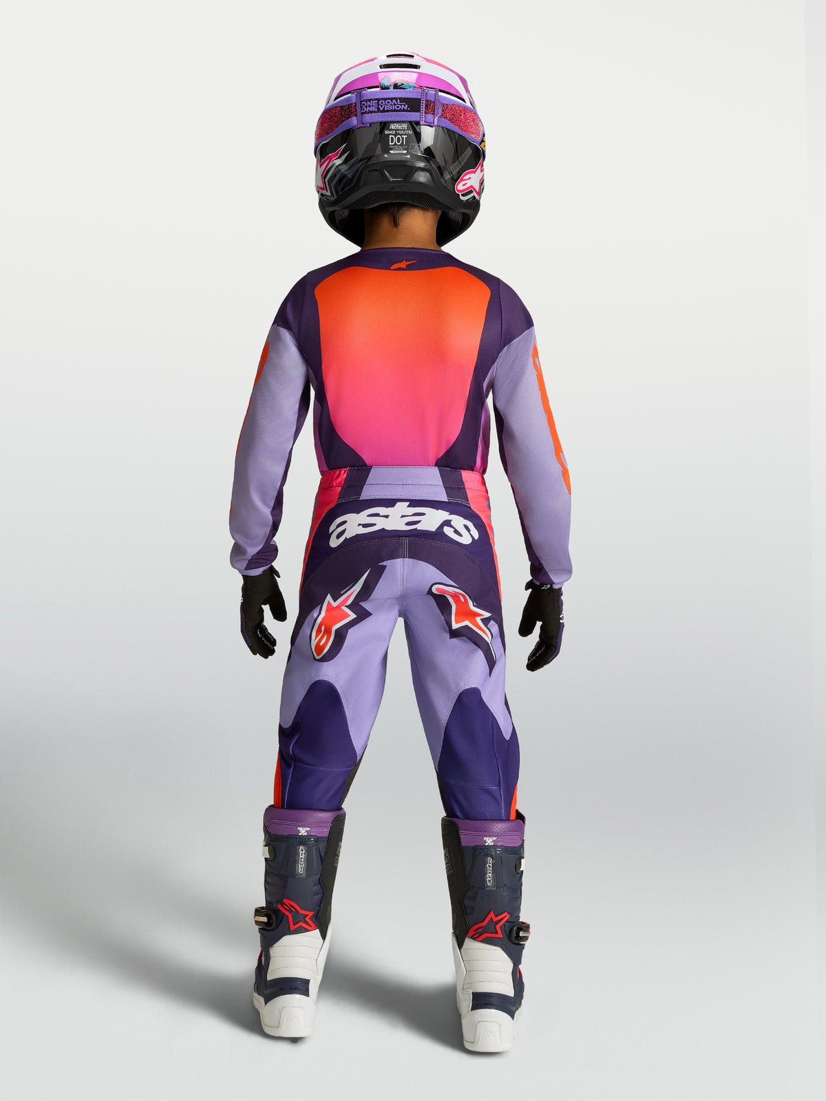 Alpinestars 2027 Youth Fluid Hunt Jersey and Gear Set, purple and pink fluo motocross outfit, rear view on youth rider.