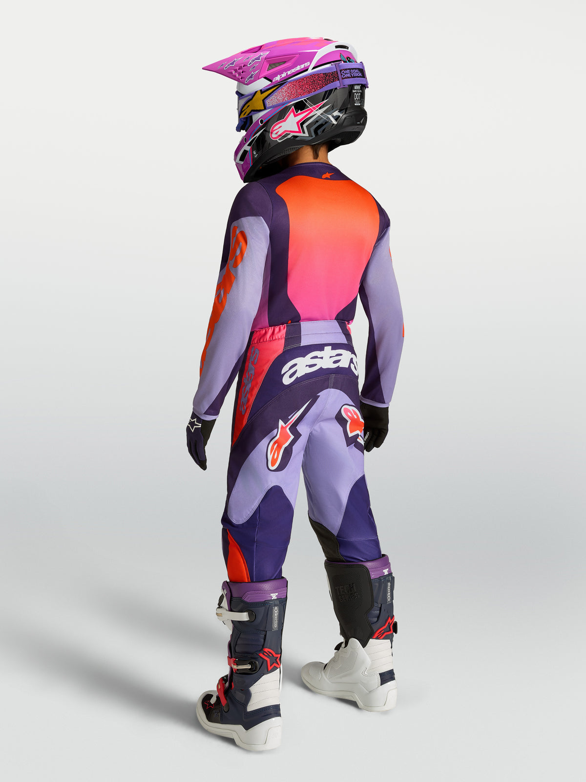 Alpinestars 2027 Youth Fluid Hunt Jersey and Gear Set in purple and pink fluo, rear view of youth motocross riding kit.
