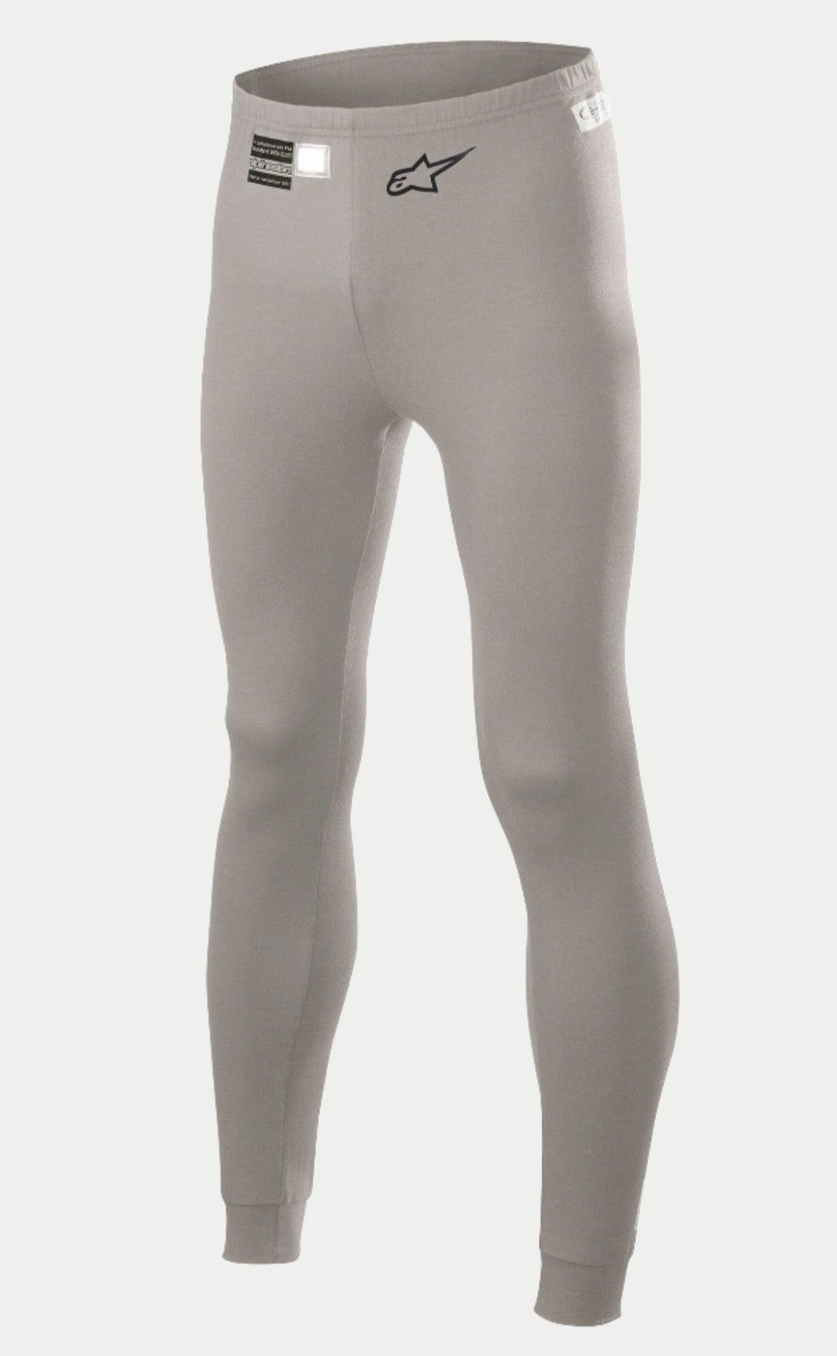 Alpinestars Race V2 Bottom FIA, pantalones de capa base para automovilismo, gris medio, con un logotipo de estrella negro en la pierna y etiqueta de homologación FIA en la cintura, tejido ligero resistente al fuego con puños en los tobillos.