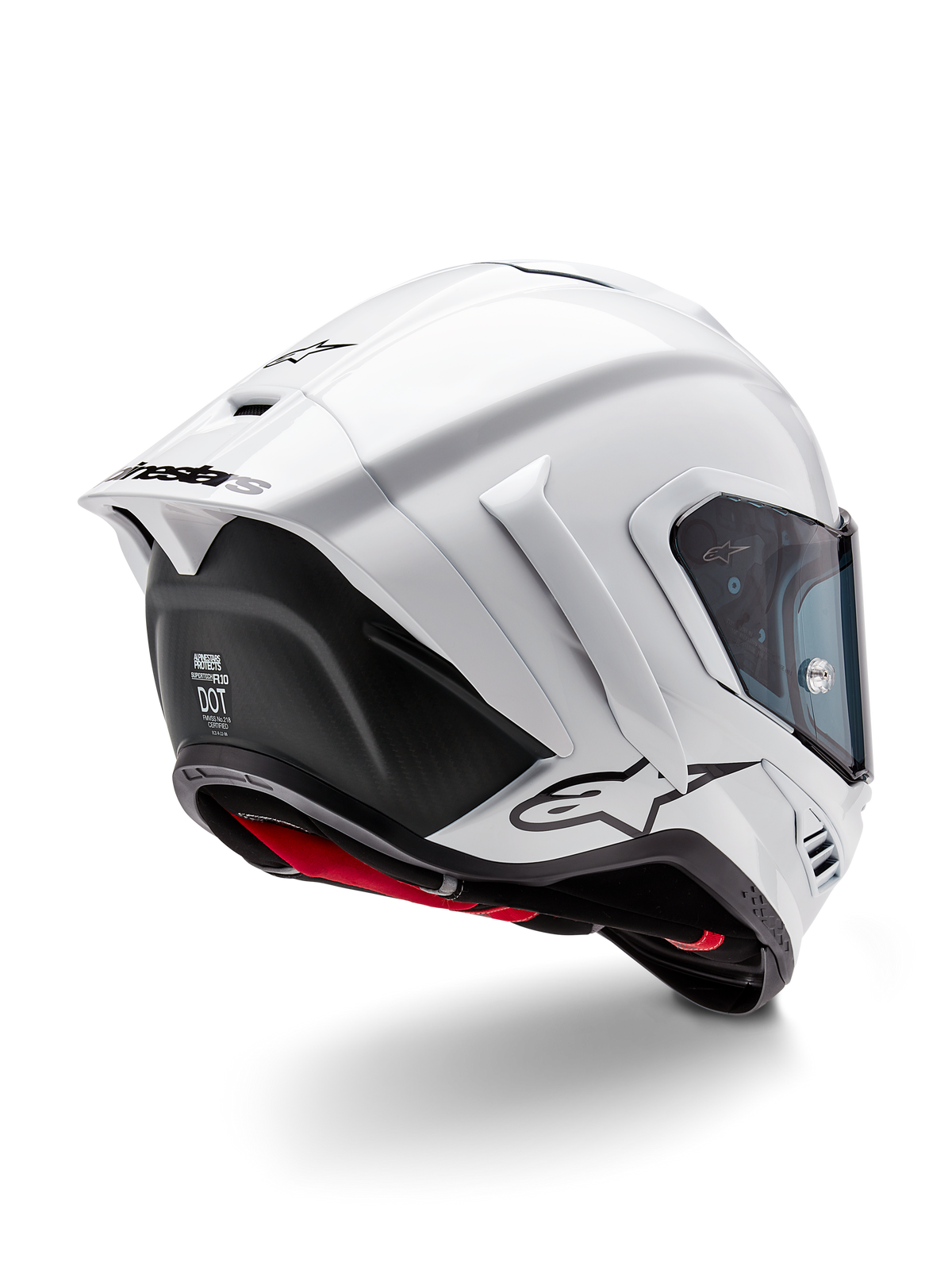 Casco Alpinestars Supertech R10 Solid, casco integral de carreras para motocicleta, blanco brillante y negro mate, vista trasera de tres cuartos con alerón aerodinámico, aletas laterales y logotipo de la marca en negro
