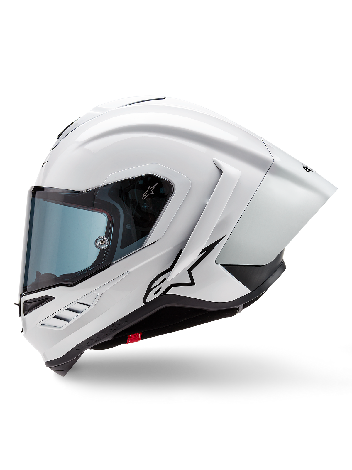 Casco Alpinestars Supertech R10 Solid, casco integral de carreras, blanco brillante y negro mate, vista de perfil lateral con alerón aerodinámico integrado y visor ahumado, con el logotipo de la estrella de Alpinestars en negro.