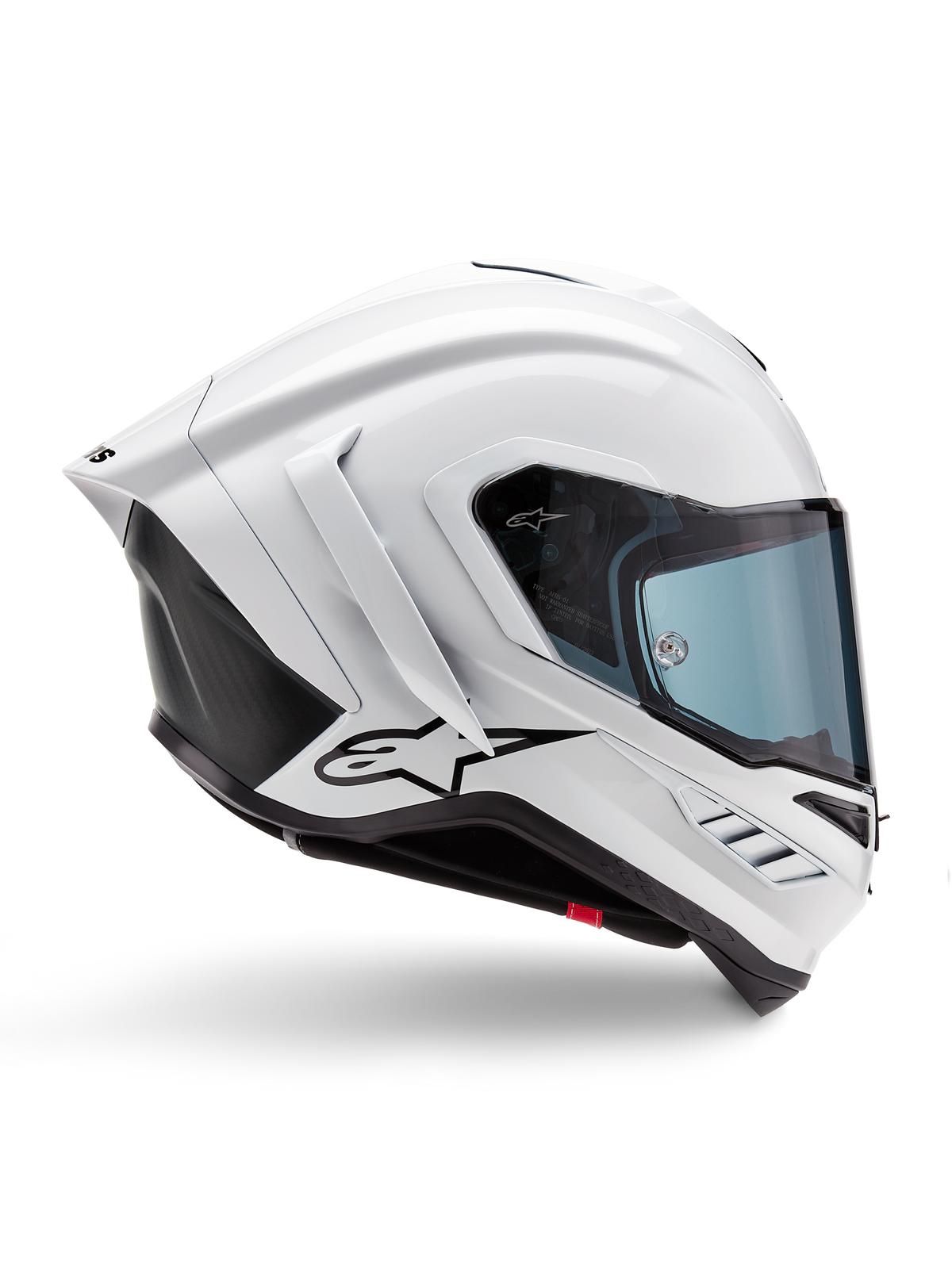 Casco Alpinestars Supertech R10 Solid, casco de competición para moto en blanco brillante y negro mate, vista de perfil lateral, diseño aerodinámico con alerones traseros y ventilaciones laterales, visera con tinte azul y logotipo de la estrella de Alpinestars en negro en el lateral