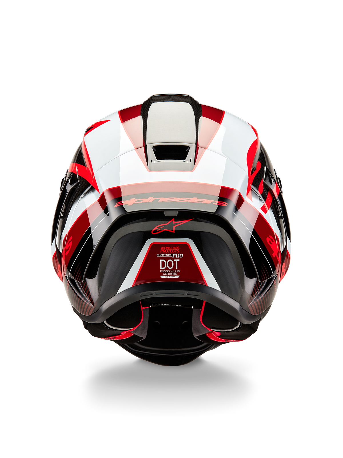 Casco Alpinestars Supertech R10 Team, vista trasera, carbono negro, rojo y blanco brillante, diseño de calota aerodinámica con paneles llamativos en rojo y blanco, con la marca Alpinestars en el alerón y un logotipo de estrella roja, casco de moto de competición profesional