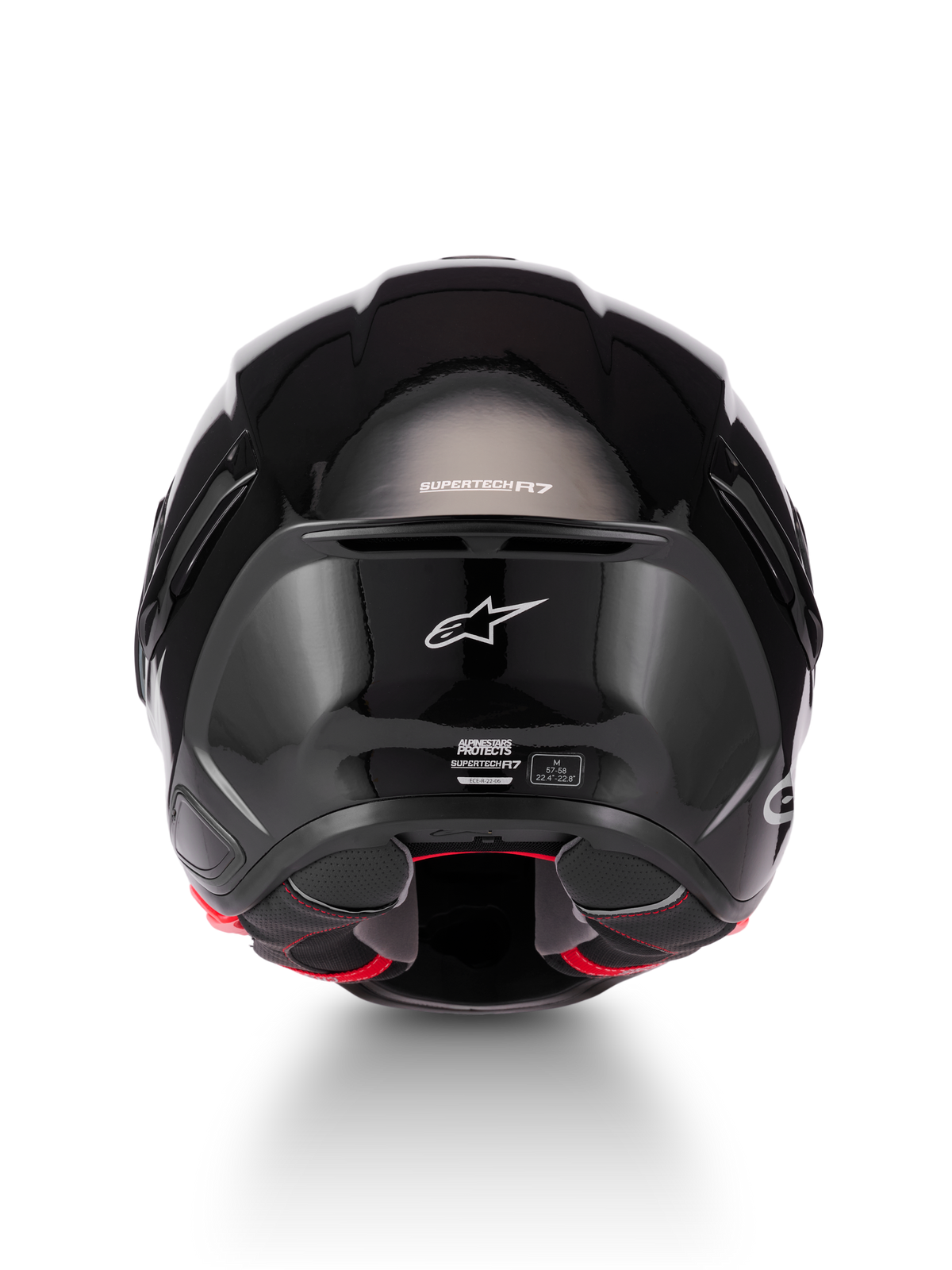 Alpinestars Supertech R7 Solid Casco, casco de moto negro brillante, vista trasera con calota de compuesto de carbono, logo de Alpinestars en blanco y detalles de certificación ECE 22.06