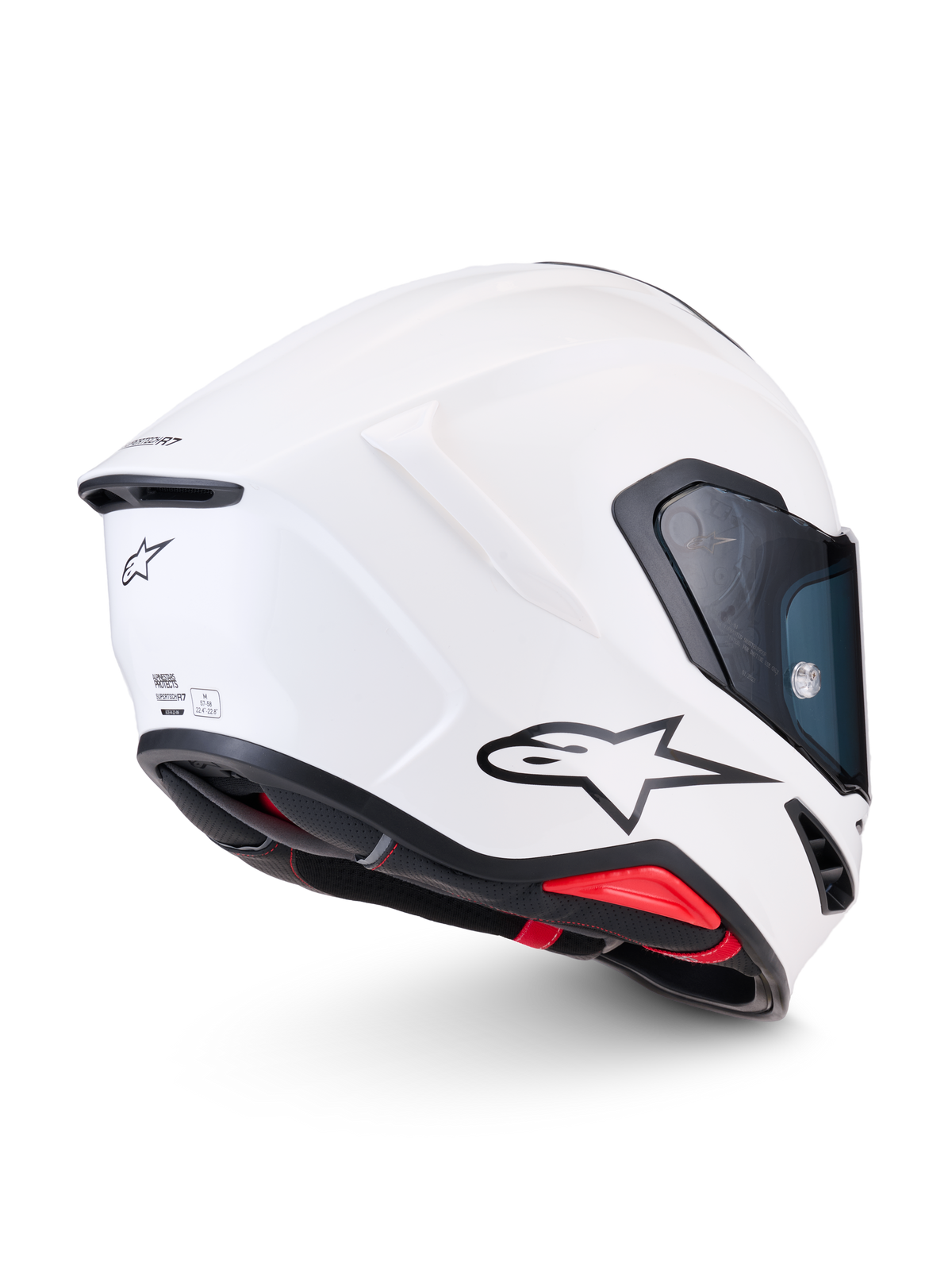 Alpinestars Supertech R7 Solid, casco integral de moto para carreras, blanco brillante, vista de perfil lateral trasero que muestra la calota aerodinámica de compuesto de carbono, el logotipo negro de A-star y los detalles de certificación ECE 22.06