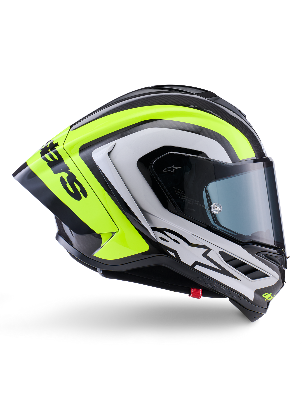 Casco Alpinestars Supertech R10 Arius, casco integral de competición, negro, plata y amarillo flúor brillante, vista de perfil lateral que muestra la calota aerodinámica y el visor ahumado oscuro, construcción en fibra de carbono con logotipo llamativo
