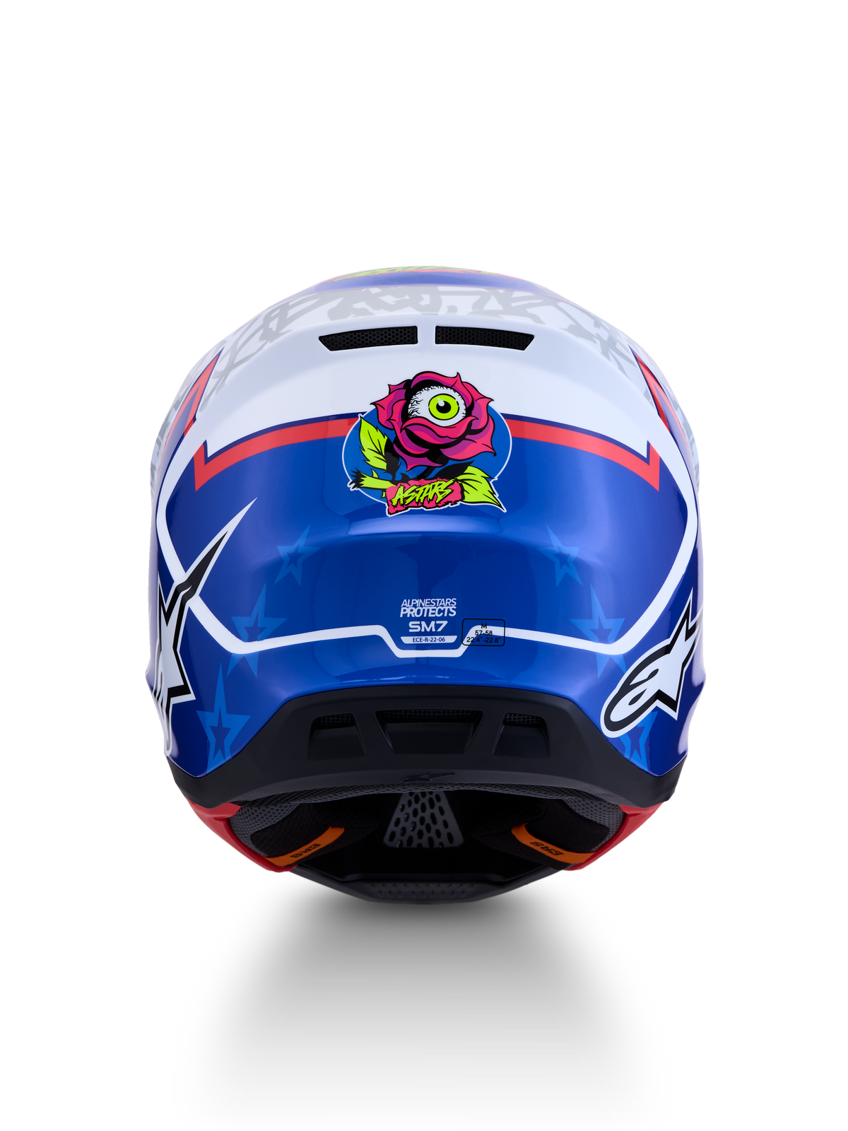 Alpinestars casco S-M7 Blaster ECE06, casco de motocross para hombre, azul y blanco, vista trasera con gráfico de rosa y ojo, certificación ECE 22.06 visible, diseño aerodinámico para off-road