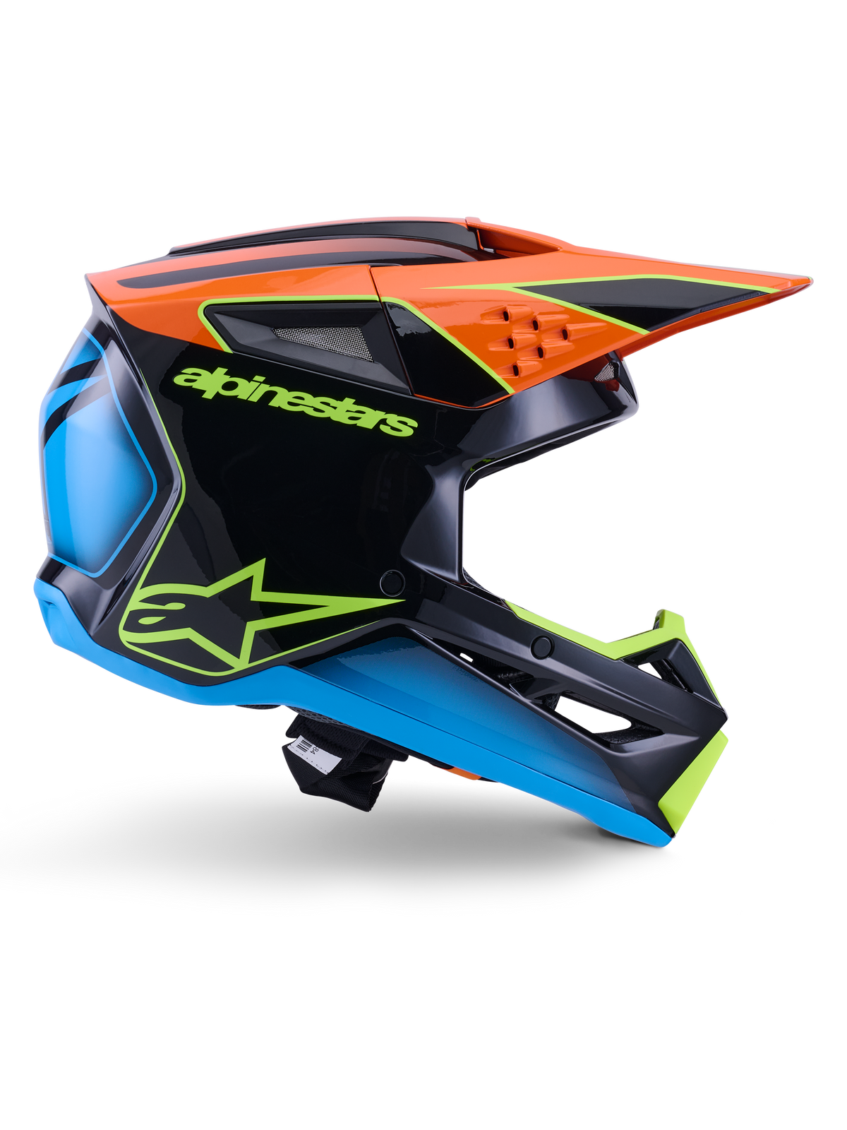 Alpinestars S-M3 Fray Helmet ECE 22.06, casco de motocross, negro, naranja, azul y amarillo neón, perfil lateral de una calota aerodinámica brillante con una visera naranja prominente, logotipos en verde neón y detalles en azul, protección para carreras todoterreno