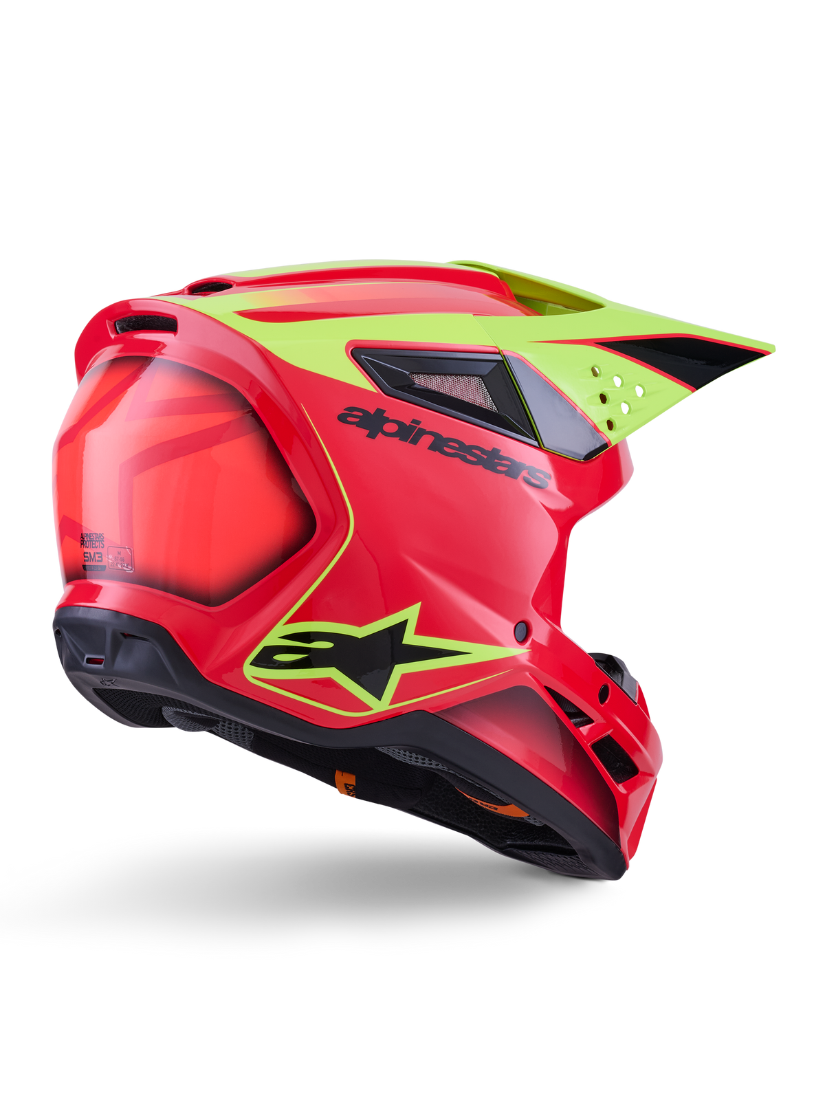 Casco Alpinestars S-M3 Fray ECE 22.06, casco de motocross, rojo, amarillo flúor y negro brillante, vista trasera de tres cuartos que muestra la calota aerodinámica con múltiples puertos de ventilación, gráficos en amarillo neón y el logotipo de Alpinestars en negro.