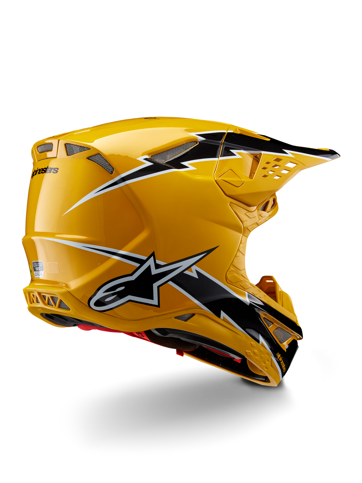 Casco Alpinestars Supertech M10 Ampress, casco de motocross, negro y amarillo brillante, con un acabado amarillo de alto brillo y gráficos estilo rayo en blanco y negro, vista trasera de tres cuartos que muestra la calota aerodinámica y puertos de ventilación integrados