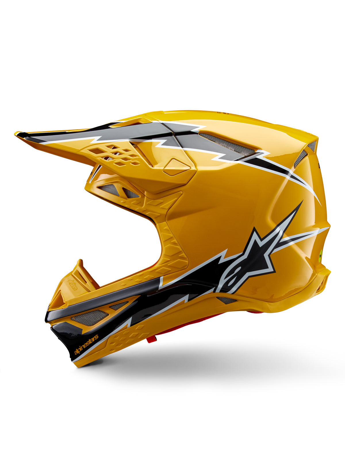 Casco Alpinestars Supertech M10 Ampress, casco de motocross, amarillo brillante con gráficos en negro y blanco, vista lateral con diseños angulares llamativos, logotipo de la estrella de Alpinestars y múltiples puertos de ventilación con malla plateada, equipo profesional de carreras off-road