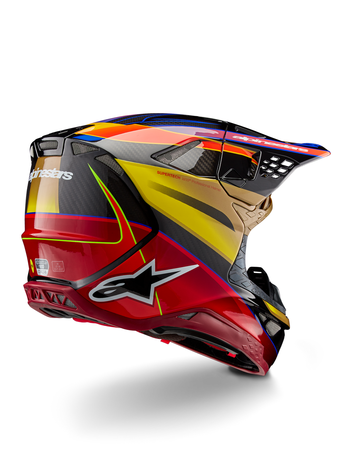 Alpinestars Supertech M10 Era Helmet, Motocross Helmet, Gold Yellow Rio Red Glossy, rear three-quarter view showing carbon fiber shell with red and yellow graphics, blue accents, aerodynamic profile with multiple ventilation ports and bold Astar logo.