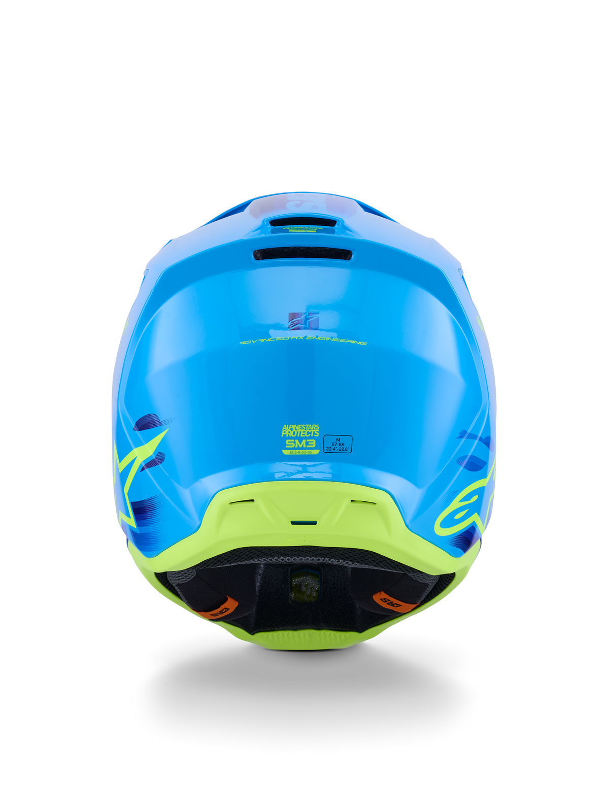 Casco Alpinestars S-M3 Force OCD, casco de motocross, cian brillante con detalles en verde lima y amarillo, vista posterior que resalta la construcción aerodinámica de la calota, puertos de ventilación de escape y marcas de seguridad ECE 22.06.