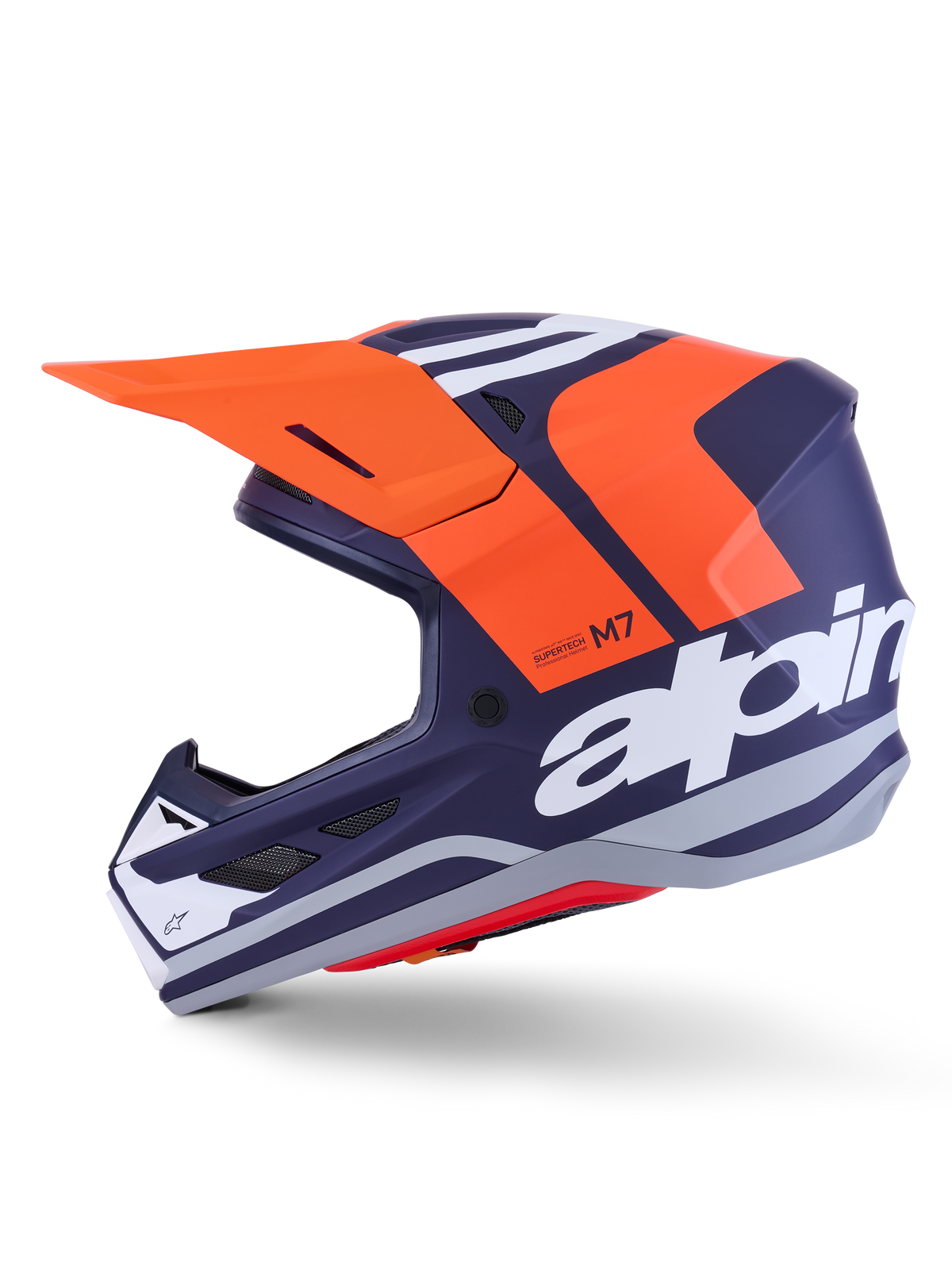 Casco Alpinestars S-M7 Core ECE 22.06, perfil lateral, acabado mate en azul marino y naranja, gran logotipo blanco en el lateral, casco aerodinámico de motocross con visera protectora