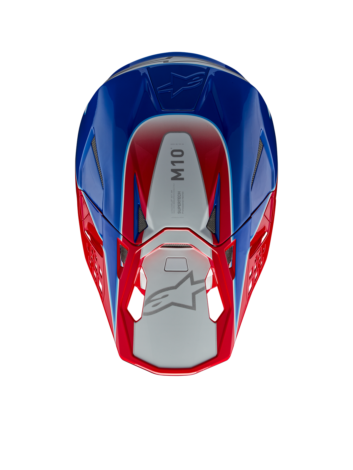 Casco Alpinestars Supertech M10 Aeon, casco de motocross, rojo y azul brillante, vista superior que muestra el panel central plateado con la marca M10, calota aerodinámica con detalles en rojo y azul, puertos de ventilación de malla, protección para la cabeza de motocross de alto rendimiento