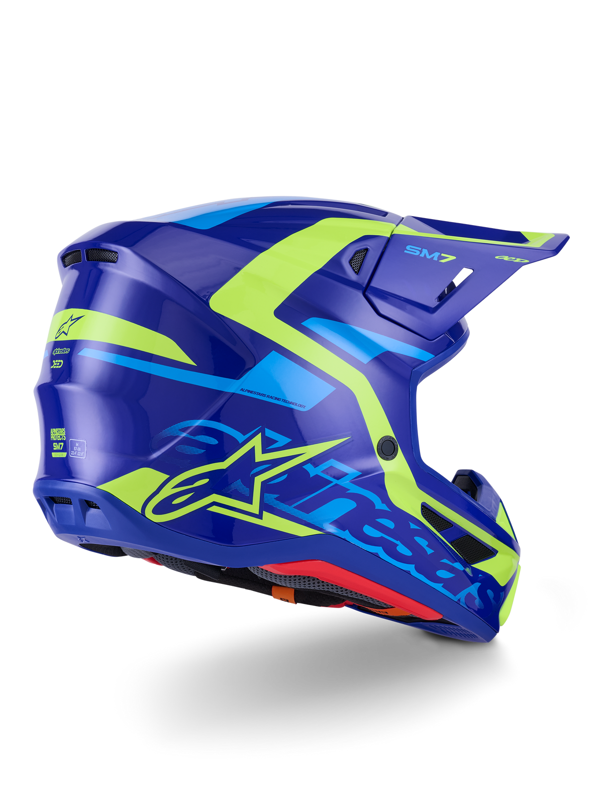 Casco Alpinestars S-M7 Deed ECE 22.06, casco de motocross, azul y amarillo flúor brillante, vista lateral-trasera con un perfil de carcasa aerodinámico y elegante, logotipos distintivos de Alpinestars con detalles en amarillo neón brillante, puertos de ventilación de alto rendimiento y acabado brillante para carreras todoterreno