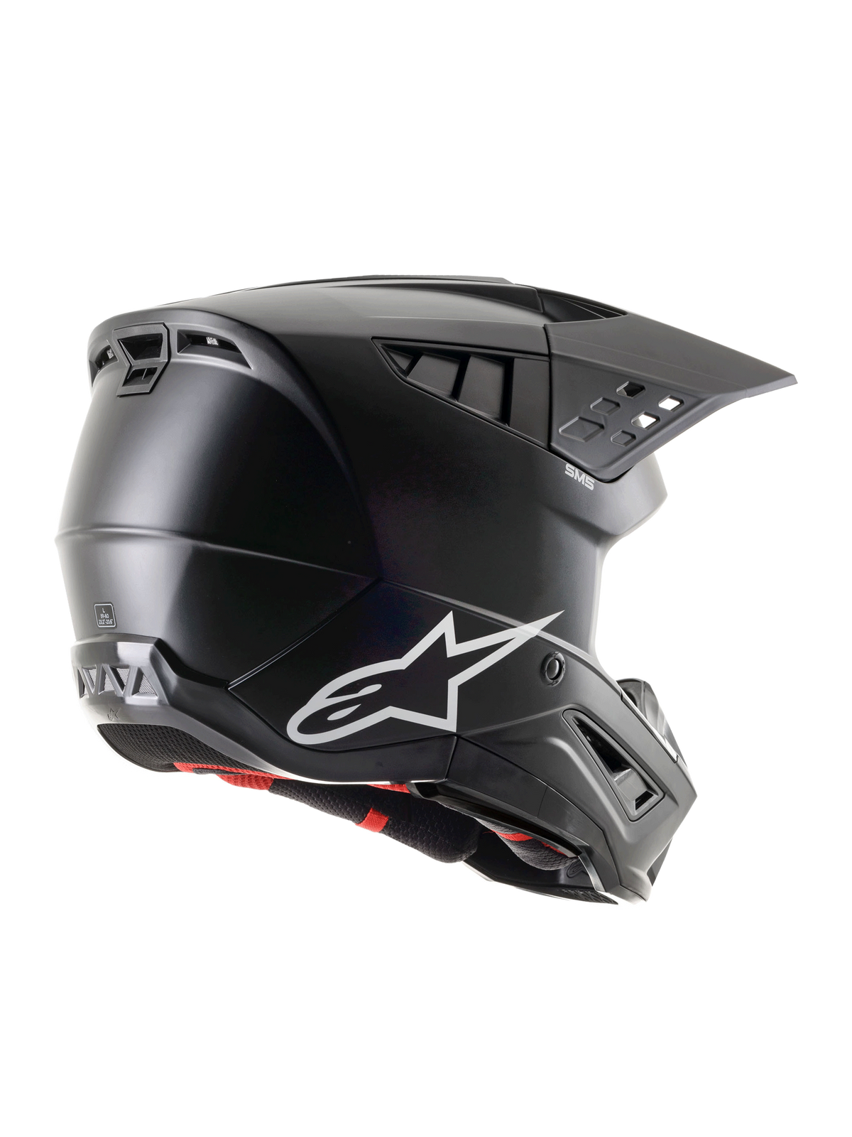 Casco Alpinestars S-M5 Solid ECE 22.06, casco de motocross negro mate, vista de perfil lateral trasera con logotipo de Alpinestars en blanco, múltiples puertos de ventilación y visera integrada para protección en conducción off-road