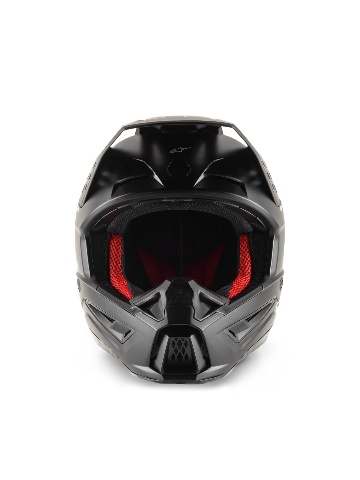 Casco Alpinestars S-M5 Solid, casco de motocross, negro mate, vista frontal con acolchado interior rojo, mentonera esculpida con puertos de ventilación y visera protectora para carreras todoterreno