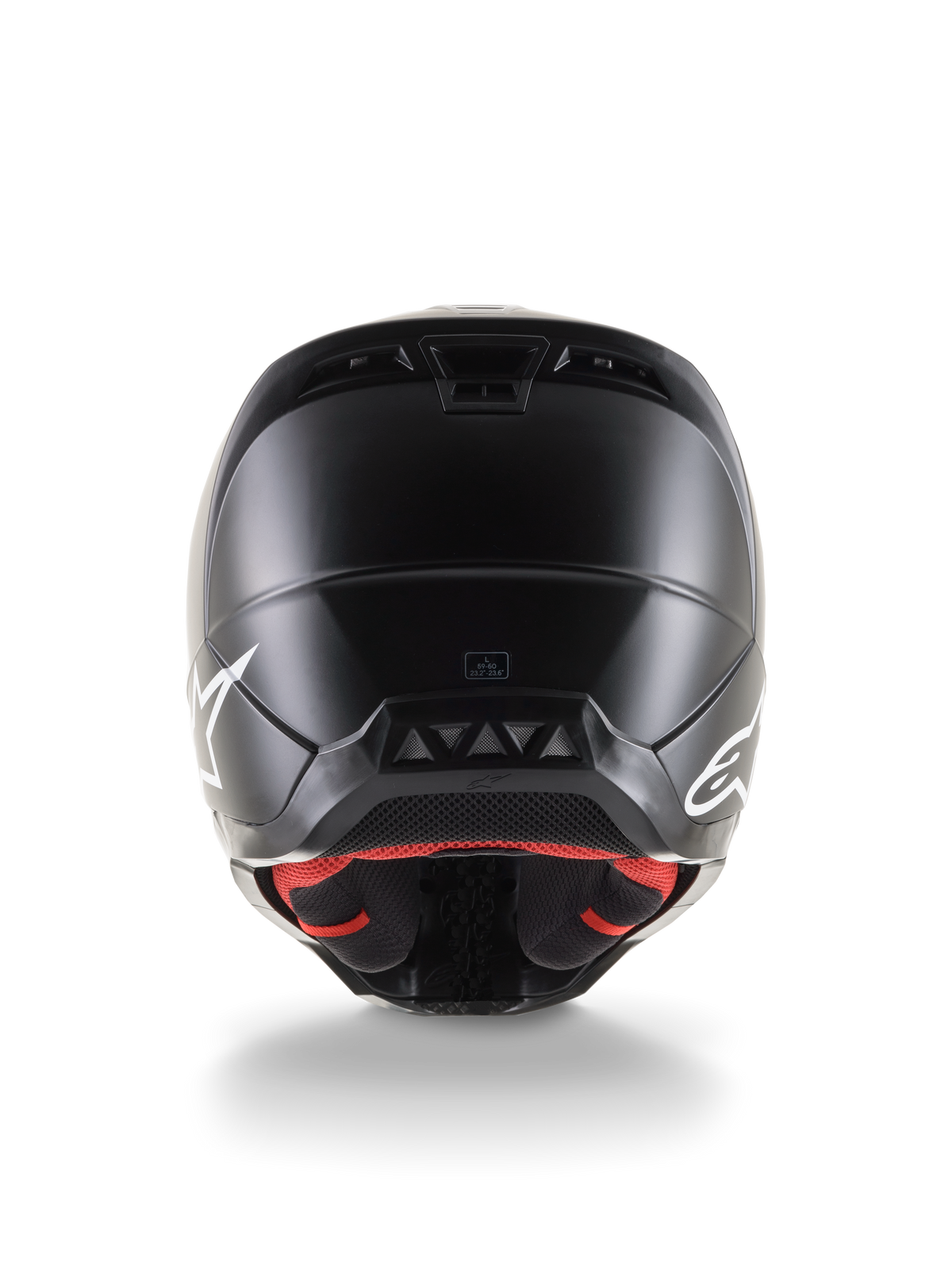 Vista trasera del casco Alpinestars S-M5 Solid ECE 22.06, casco de motocross, acabado negro mate, con logotipos blancos de Alpinestars en los laterales, forro interior rojo y carcasa aerodinámica con salidas de aire.
