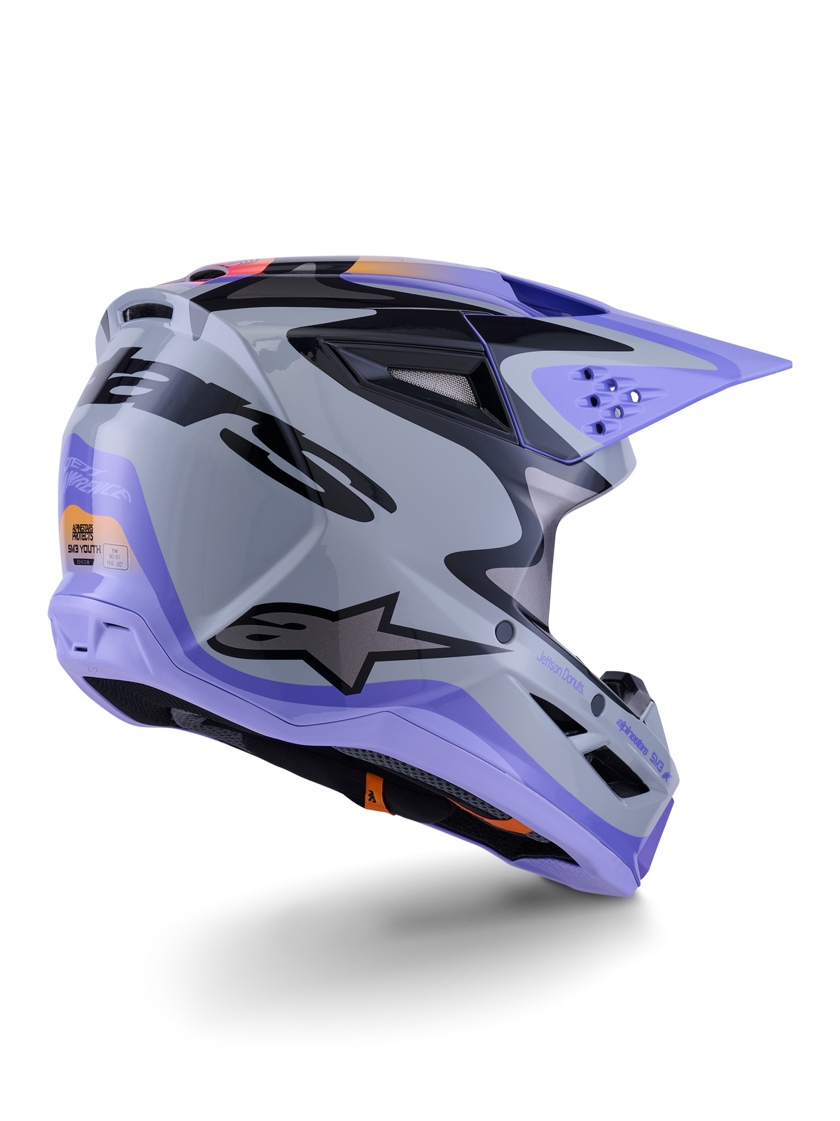 Casco Alpinestars S-M3 Jettson Juvenil, casco de motocross, gris, morado y negro brillante, vista trasera de tres cuartos, con visera morada, logotipo de Alpinestars en negro y múltiples puertos de ventilación, diseño estilizado para carreras off-road juveniles