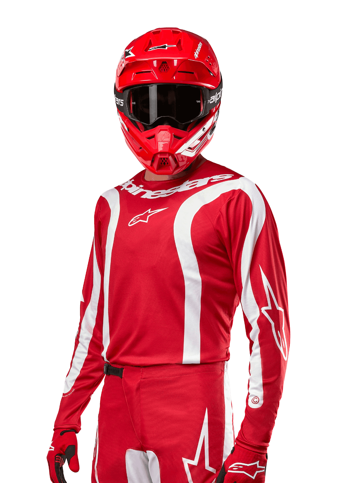 Alpinestars 2024 Fluid Lurv Jersey, jersey de motocross, rojo y blanco, usado con casco y guantes rojos a juego, diseño deportivo audaz con rayas blancas curvas y marca Alpinestars