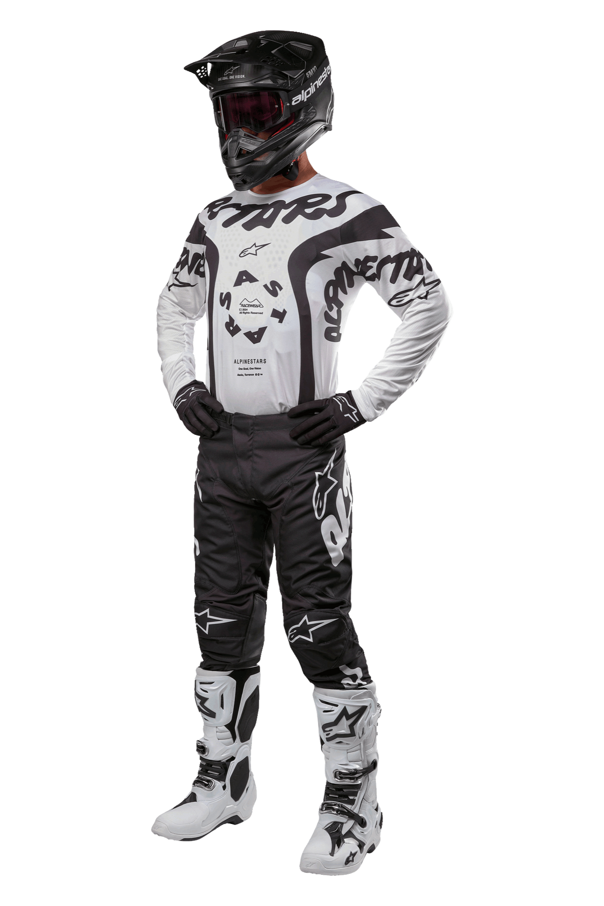 Alpinestars 2024 Racer Hana Pants, pantalones de motocross negros con logos blancos, equipo completo de motocross con jersey blanco y negro, casco negro, guantes oscuros y botas blancas con detalles negros