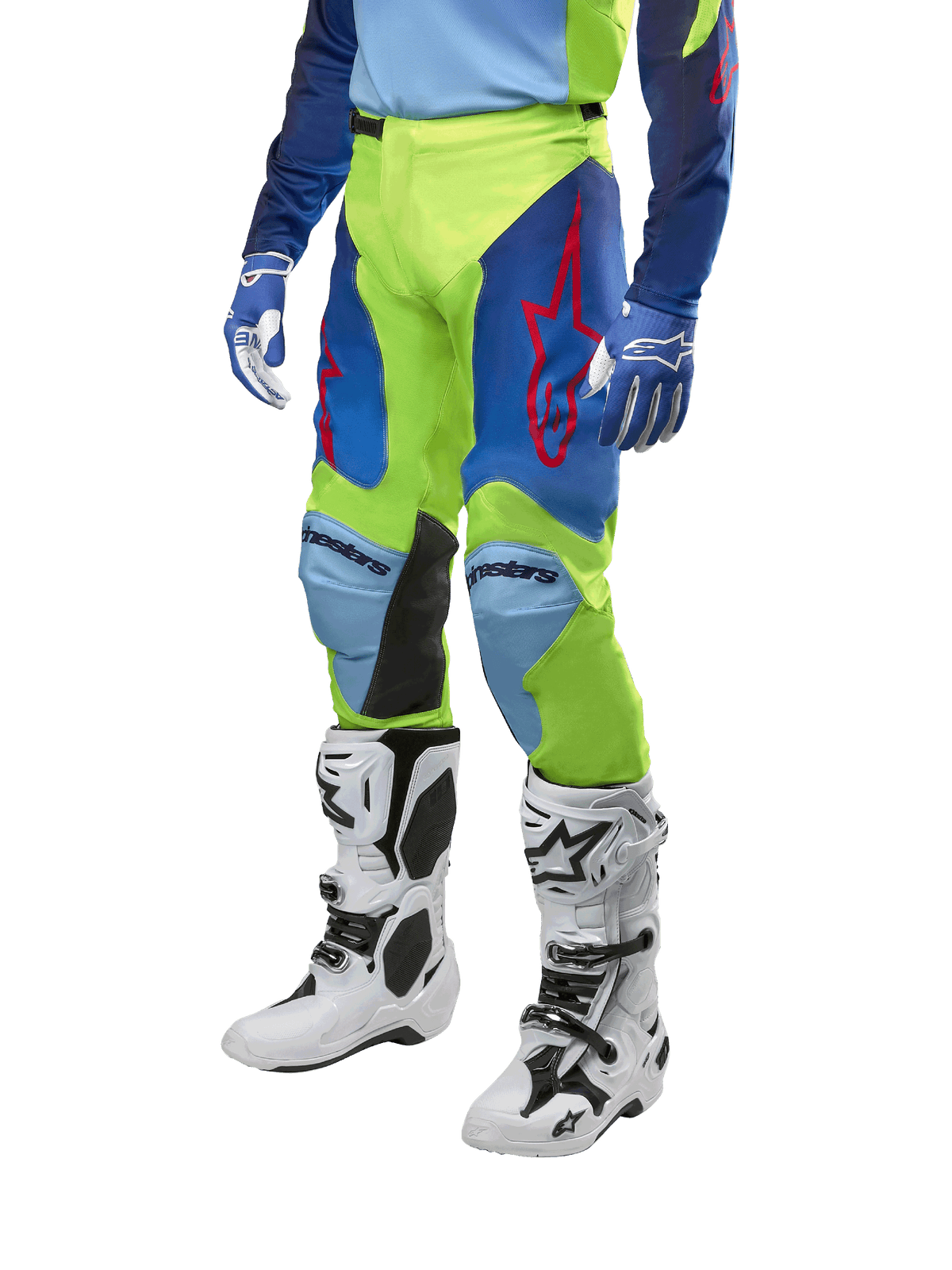 Alpinestars Racer Hoen Pants 2024, pantalones de motocross, amarillo flúor y azul noche navy, con logotipos de estrellas rojas y paneles internos negros en las rodillas, usados con jersey a juego y botas de motocross blancas, equipo de alto rendimiento para carreras todoterreno