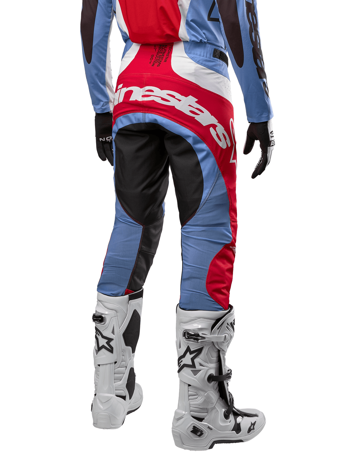 Alpinestars 2024 Techstar Ocuri Pants, Motocross Pants, Light Blue, Mars Red, and White, rear view highlighting the large red Alpinestars logo across the seat, worn with white racing boots and matching jersey.